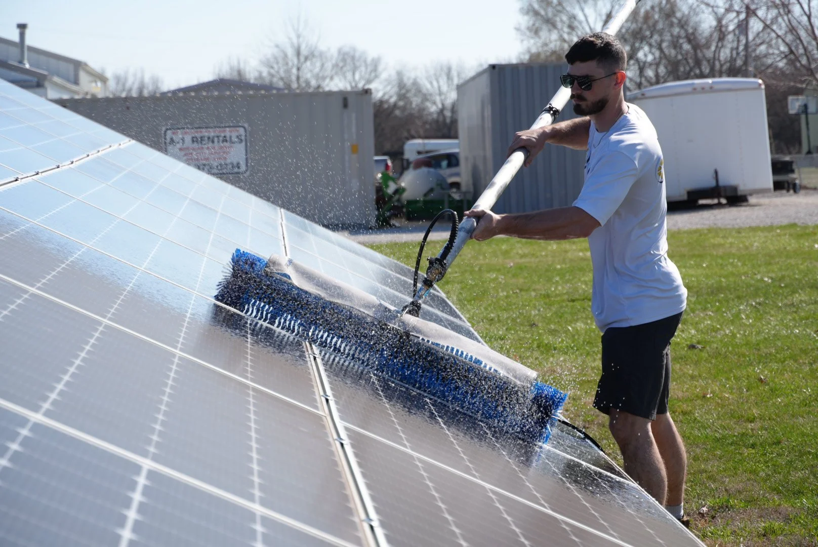 Solar Scapes cleaning a solar panel.
