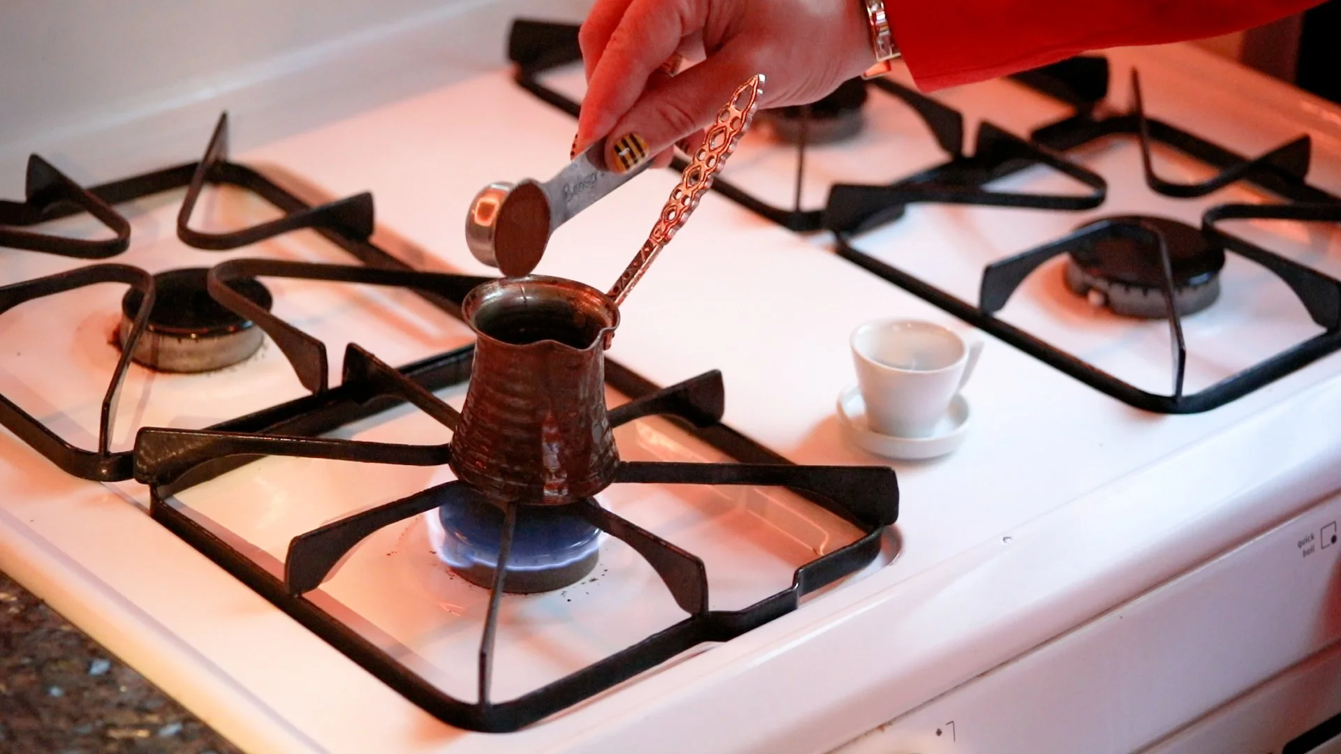 dr. honeybrew preparing turkish coffee in a cezve, or ibrik