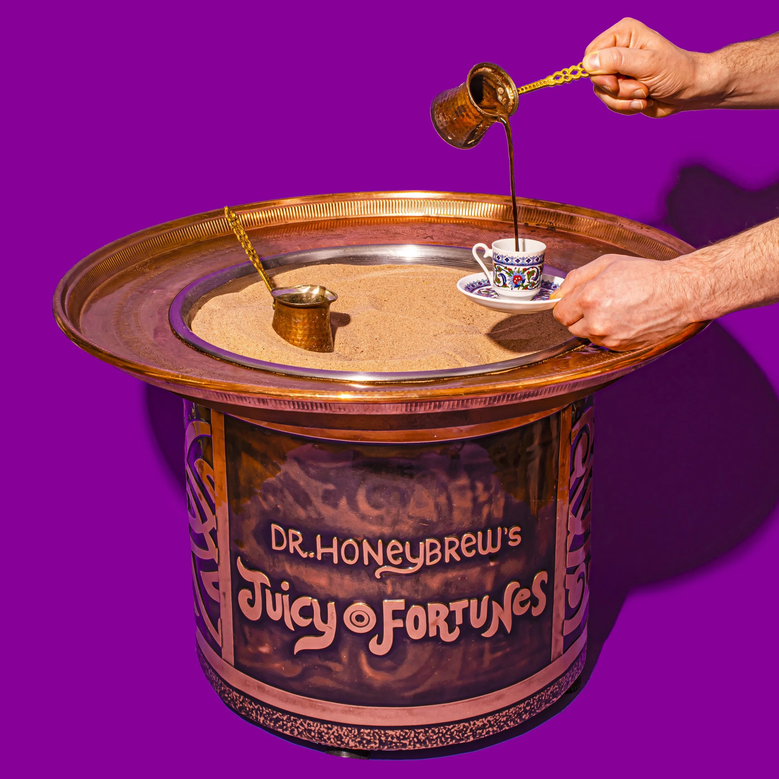 Turkish coffee being poured from a copper cezve brewed on hot sand at Dr. Honeybrew's Juicy Fortunes coffee room in New York City