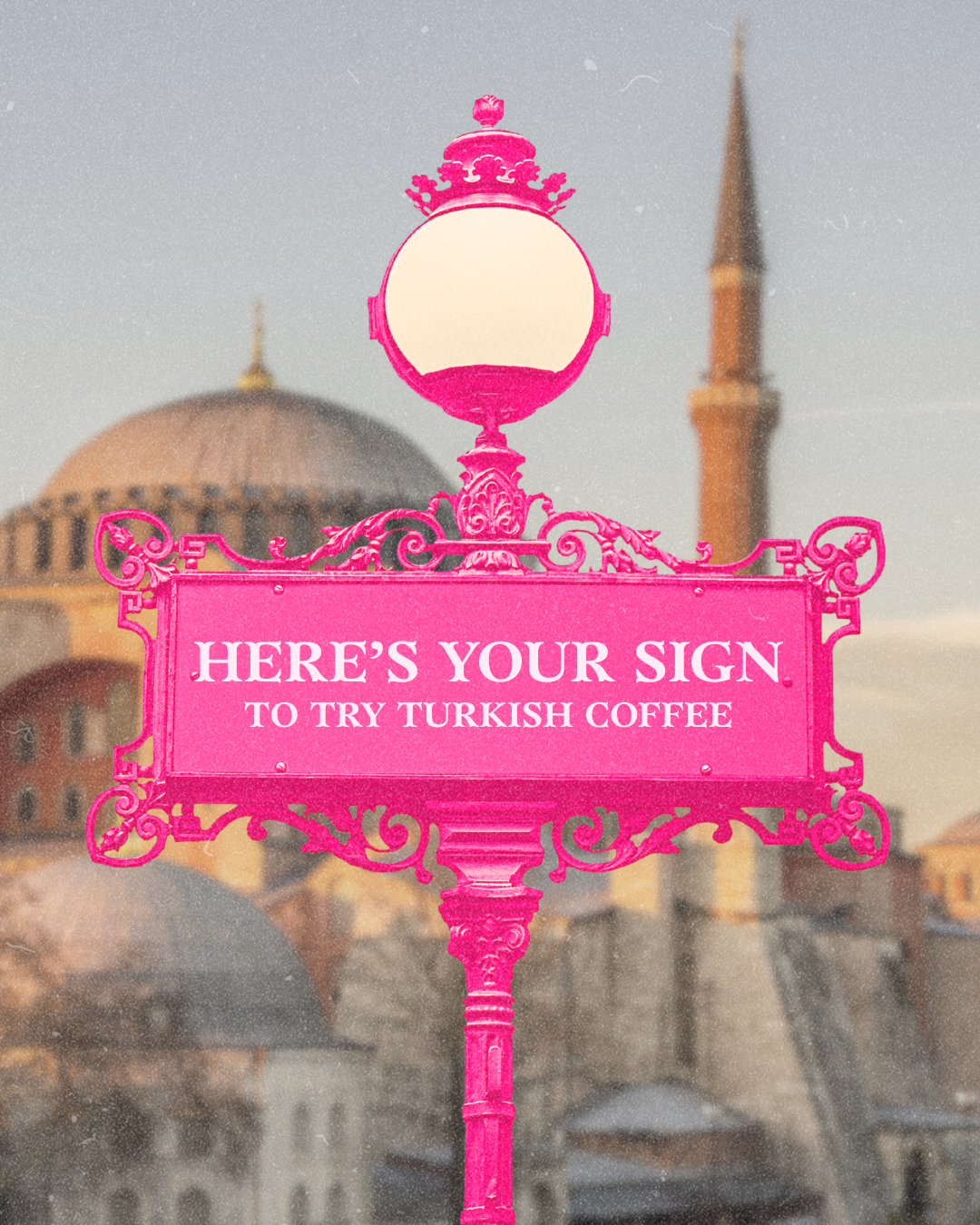 a bright pink sign against a backdrop of Istanbul that reads "here's your sign to try turkish coffee"