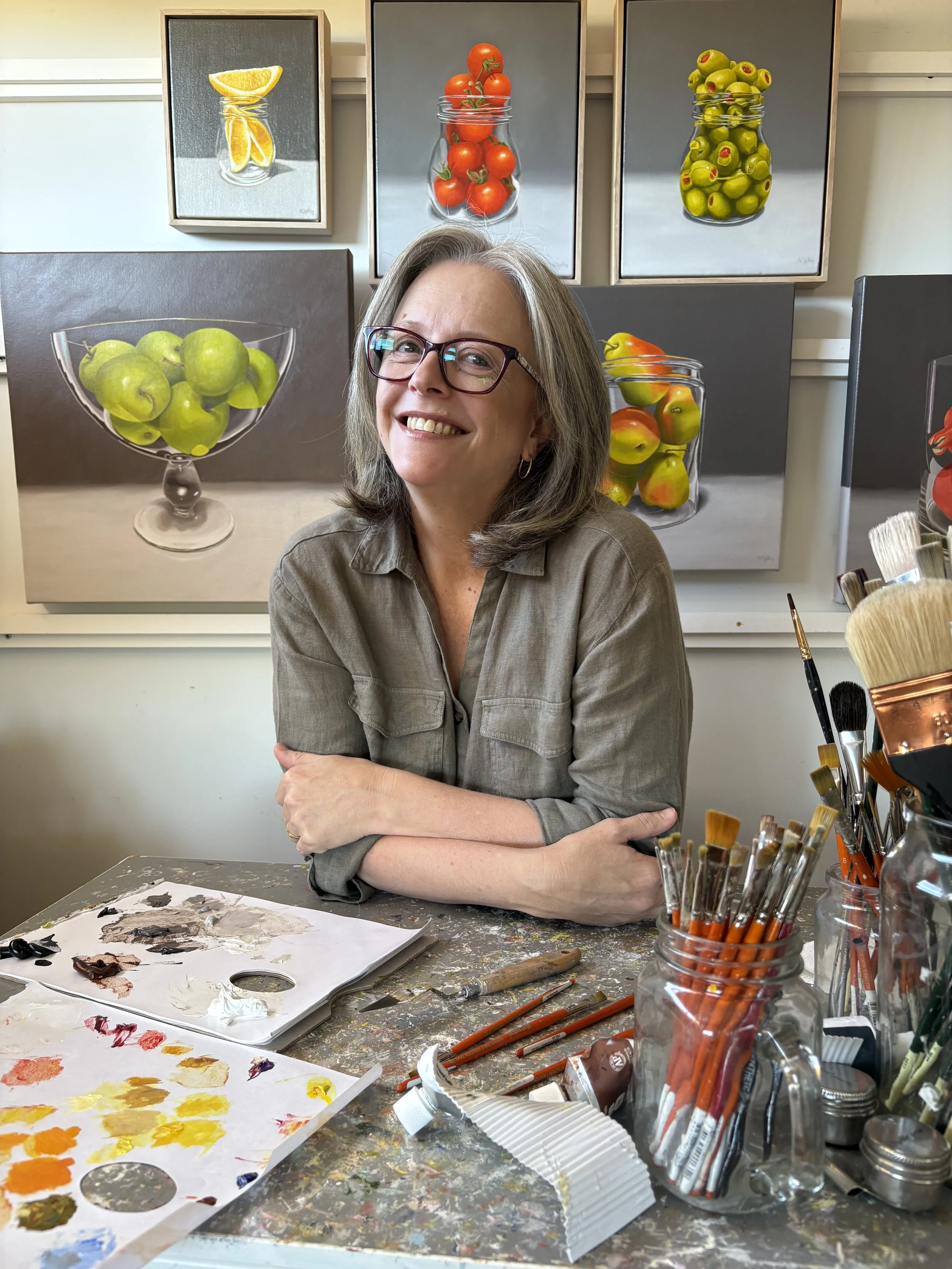 Margaret River artist Amanda Ogilby in her studio surrounded by her oil paintings