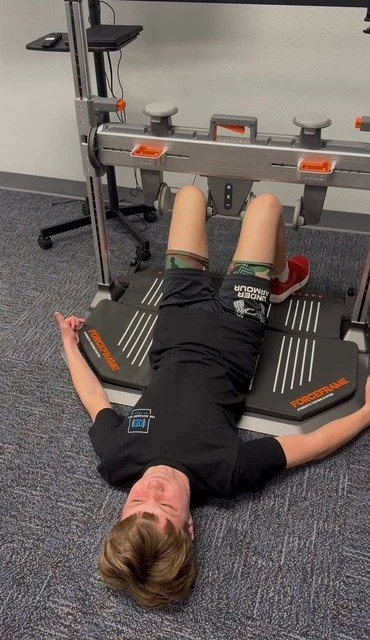 Physical therapist reviewing athlete performance testing results
