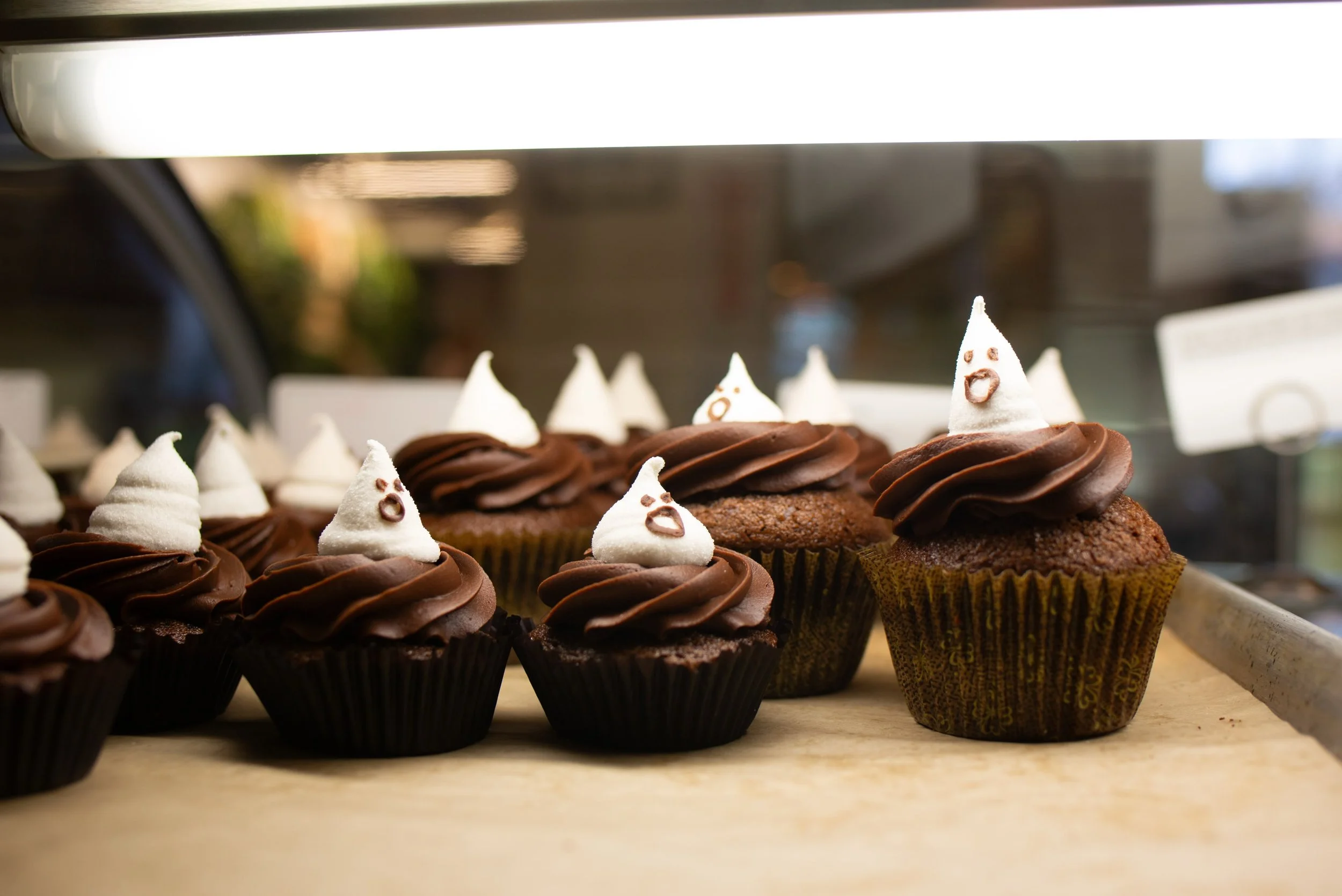 Spooky season is upon us, but these ghosts are sweet!
Made in house and perched atop our decadent chocolate cupcake. Grab a regular or petite, and make sure to come check out our festive bakers this weekend because we LOVE Halloween. Costumes in the 