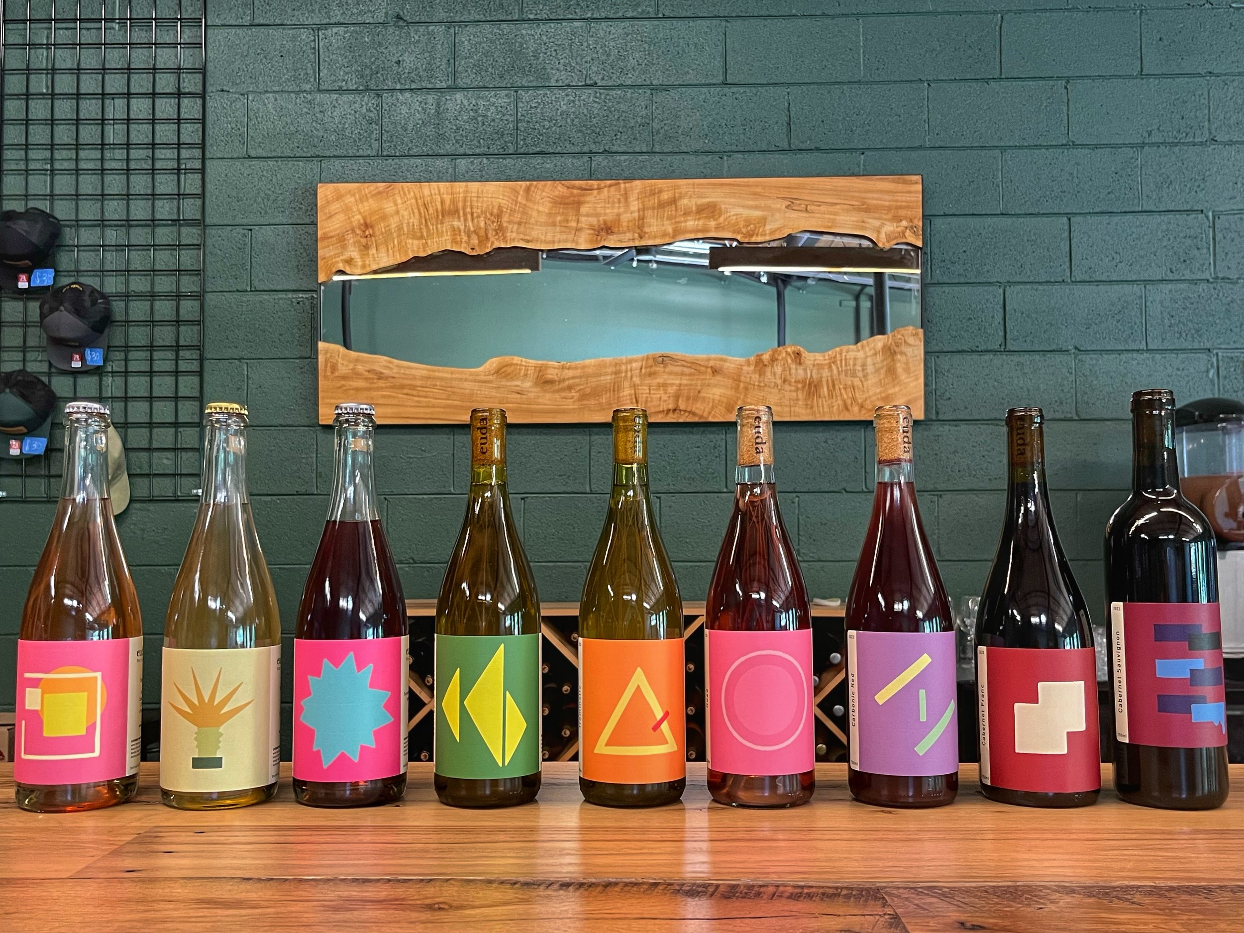 Image of all the Euda wine bottles along the bar