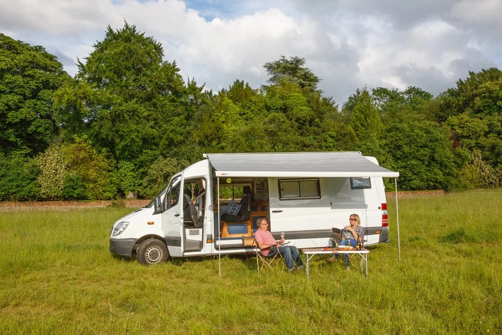 Azure set up with awning and outdoor seating, perfect for relaxed campervan motorhome hire adventures from Bristol.