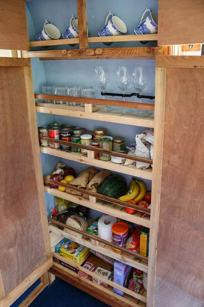 Well-organised food storage and pantry space inside Azure, designed for longer trips and practical campervan motorhome hire from Bristol.