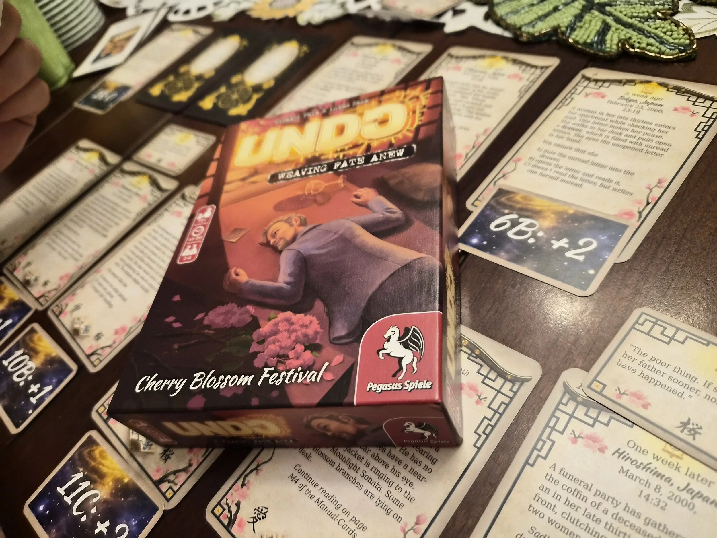 The cards and box for the board game Undo.