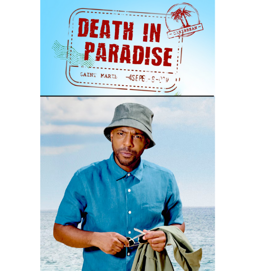 A detective stands near the tropical water.