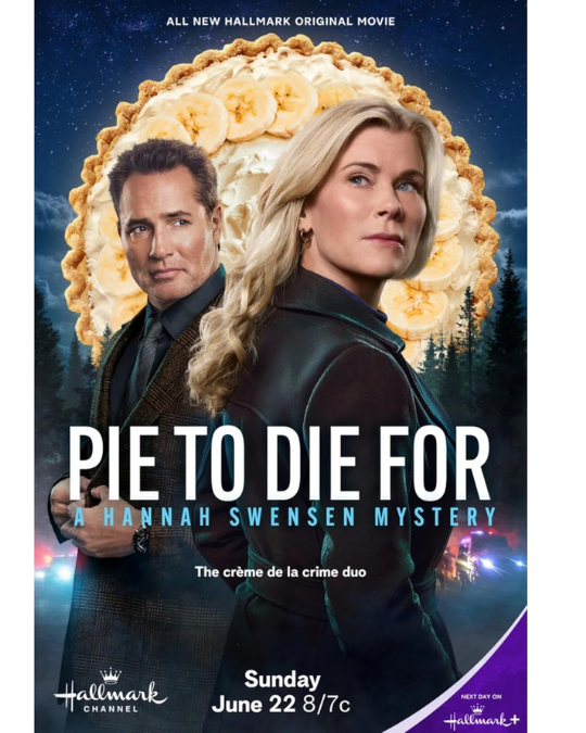 Hannah and Chad in front of a stylized banana cream pie that looks like the moon in the sky