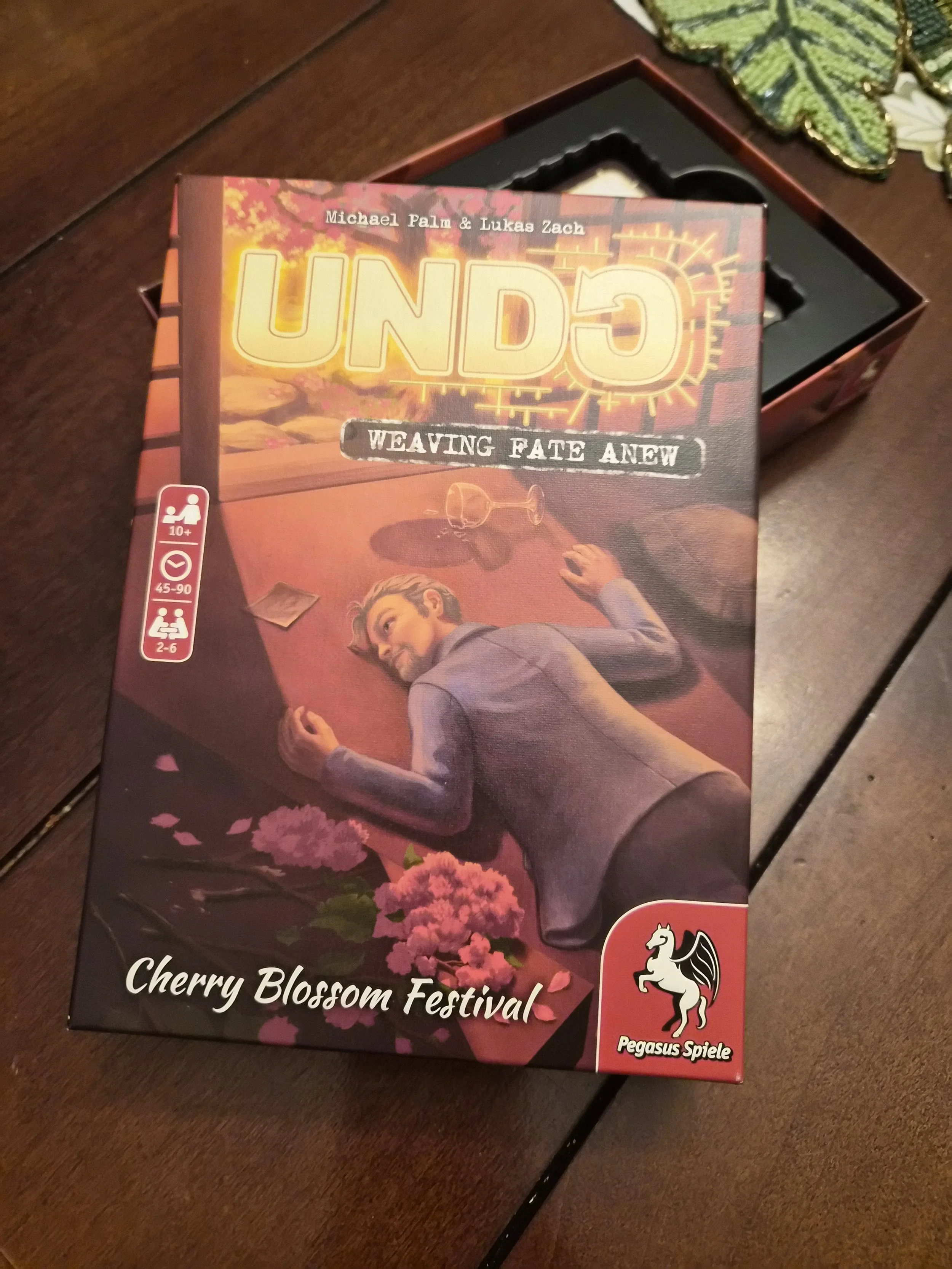 The box for the game "Undo: Cherry Blossom Festival"