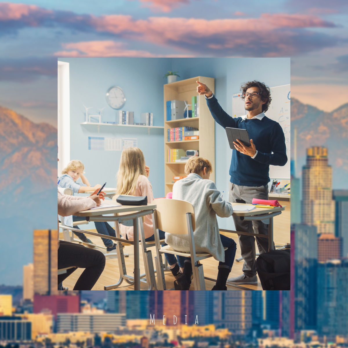 A classroom with young students paying attention to a teacher who is pointing towards a whiteboard.