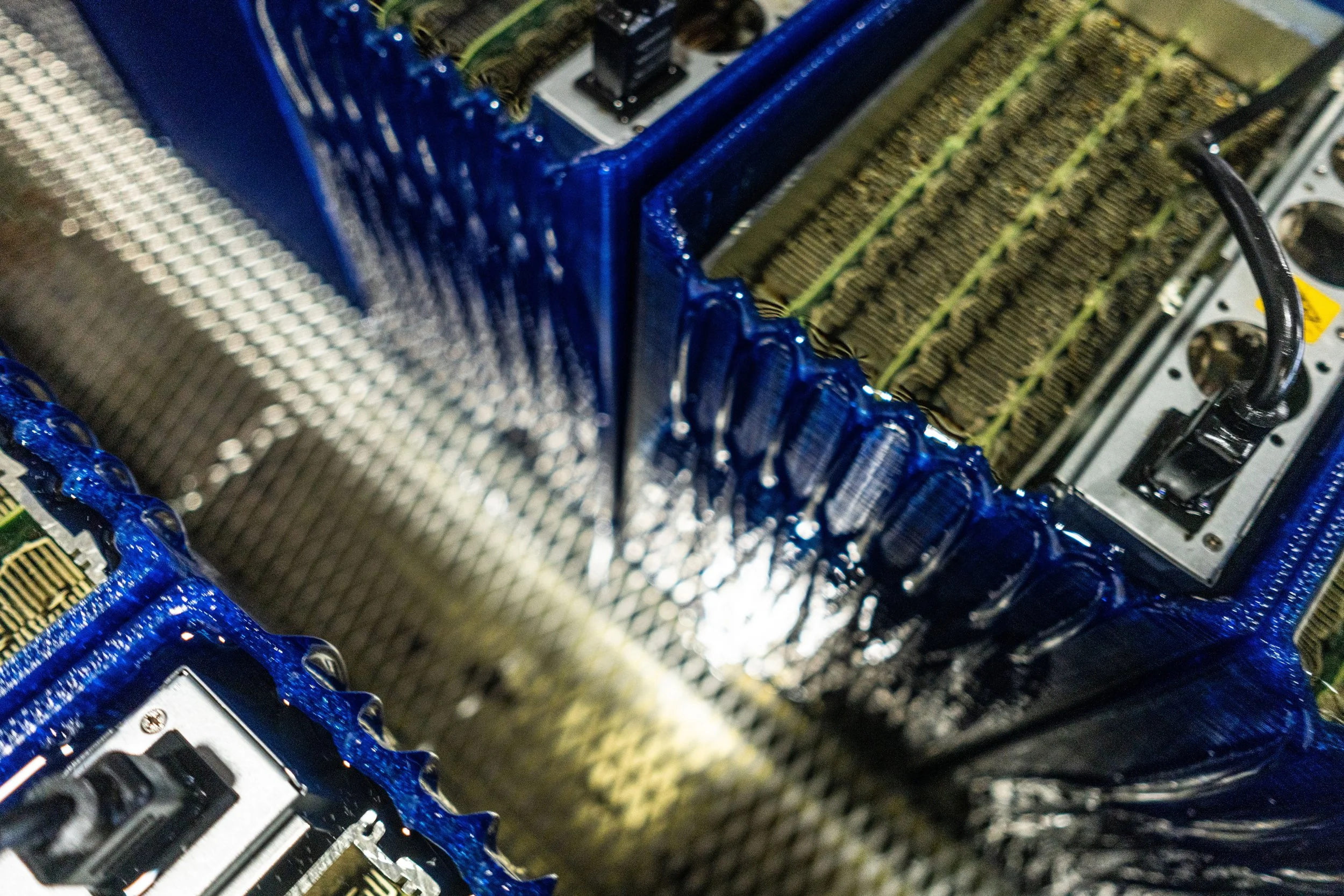 Bitcoin ASIC miner operating in SCATE Venture's immersion-cooled facility