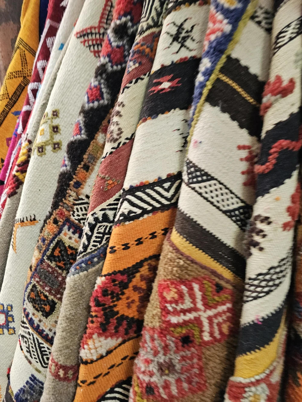 Close-up of Moroccan materials, textiles, ceramics, and mother of pearl
