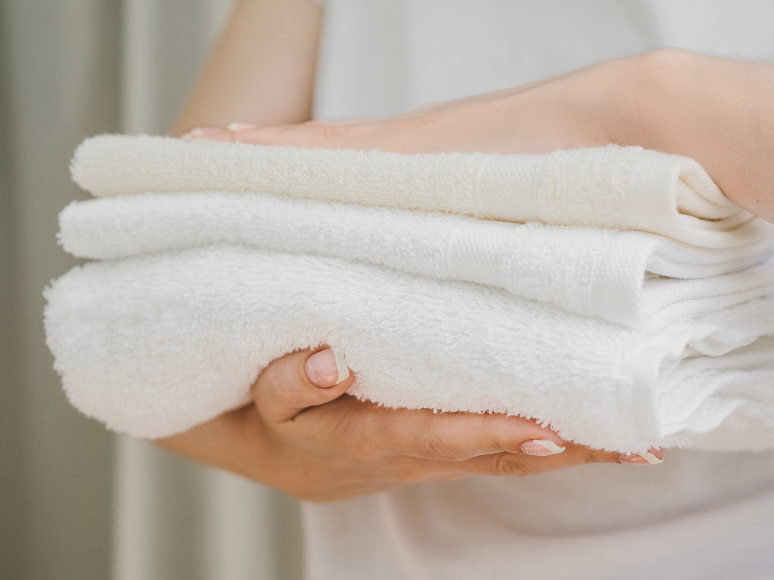 side-view-pile-towels-hands.jpg