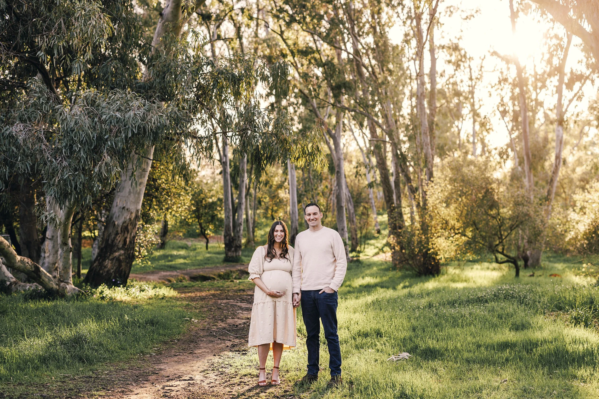 A couple gets maternity photos taken in beautiful light in Sacramento