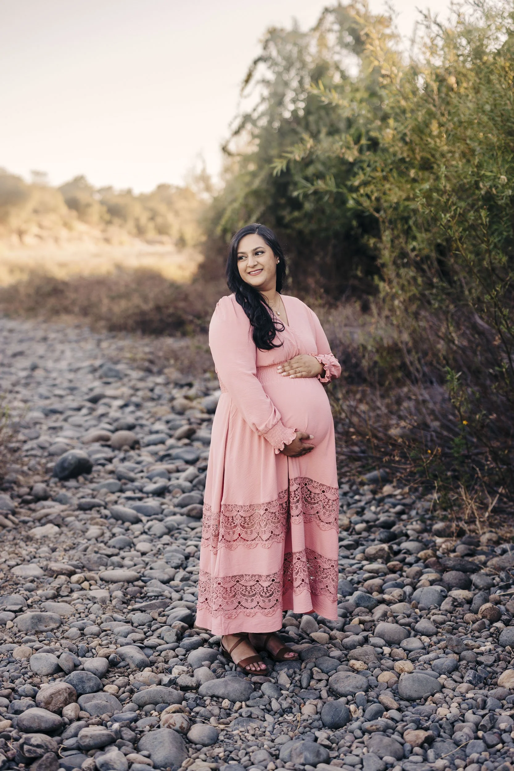 A mother to be poses for maternity photos with Sacramento Photographer Amy Wright.