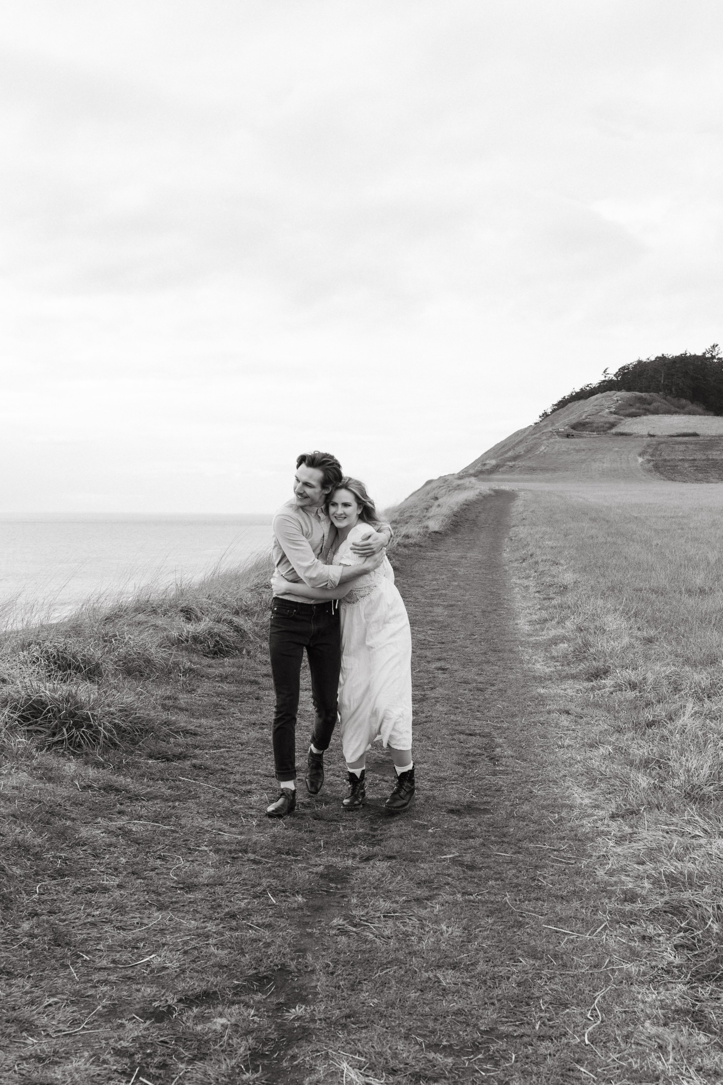 candid couple walking at ebey's landing