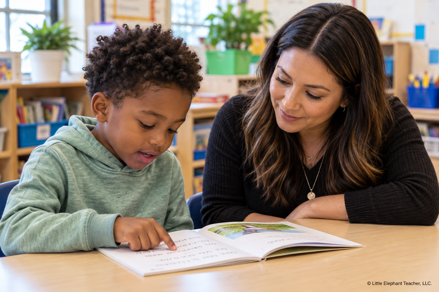 Elementary reading intervention teacher listening as a student tracks and reads a decodable passage during phonics instruction.