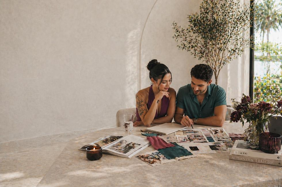 Engaged couple looking through wedding inspiration while planning their Sydney wedding