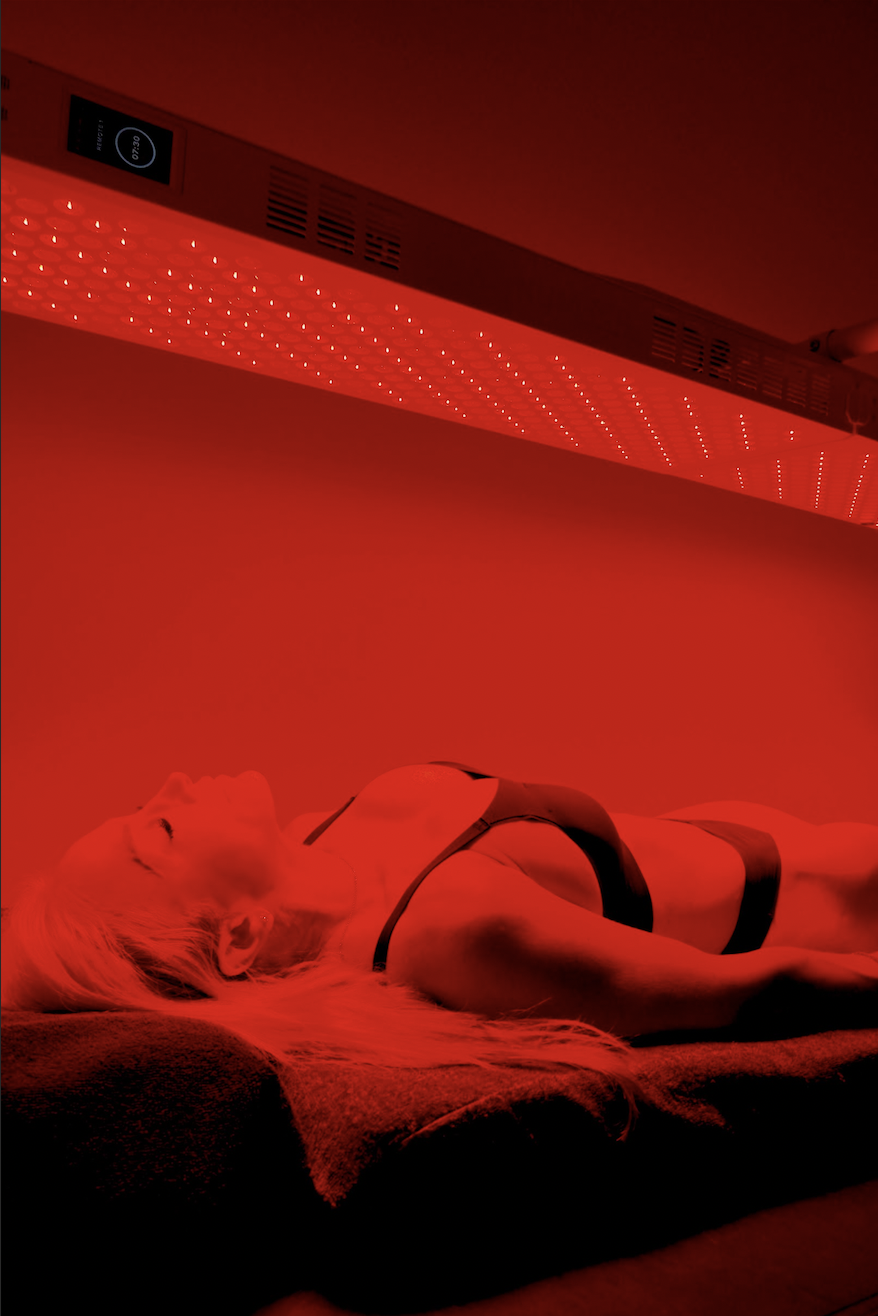 Full body red light therapy session on a far infrared bed at Sweatland South Lamar