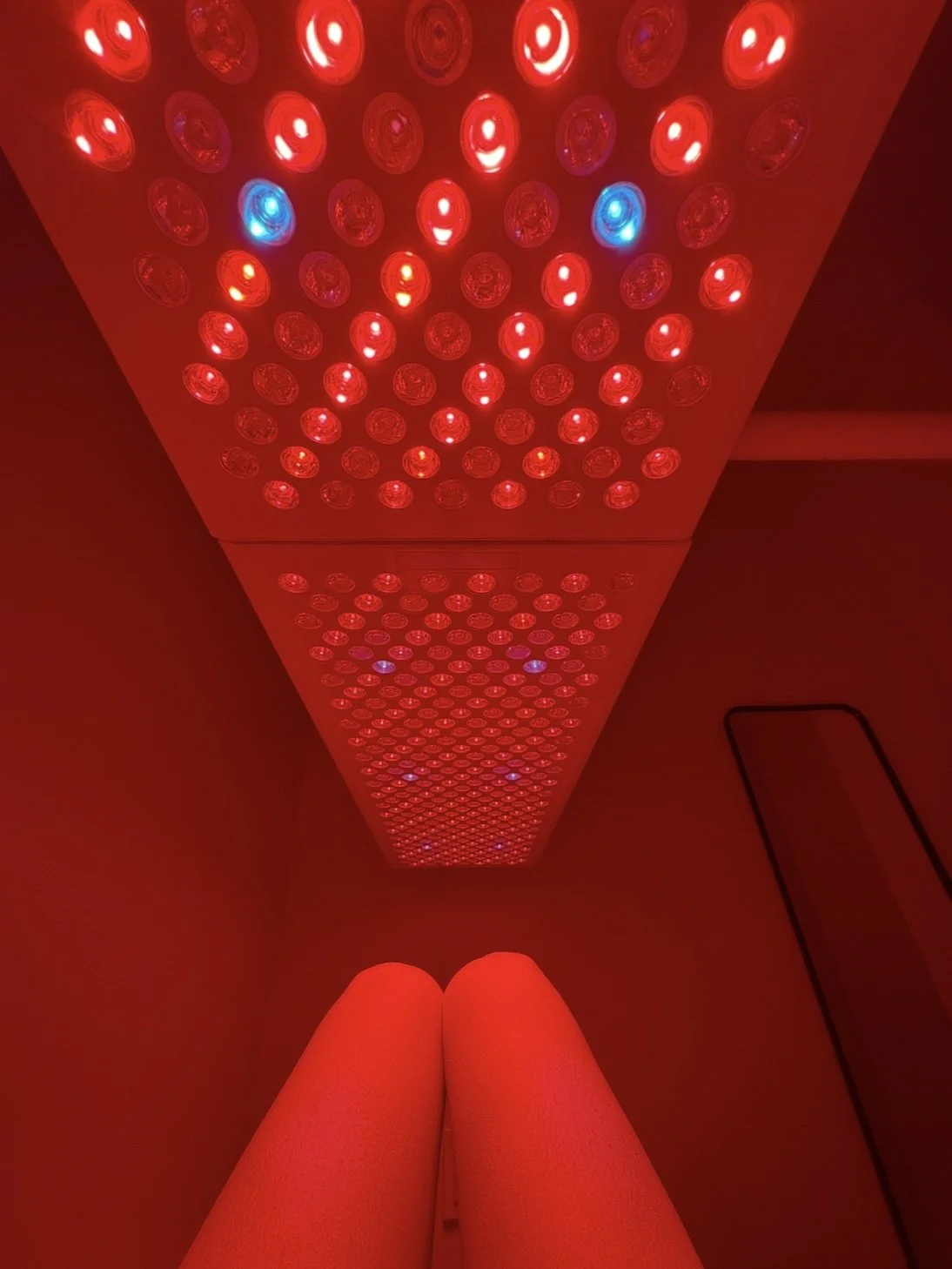 Red light therapy room ceiling array at Sweatland in Austin 78704