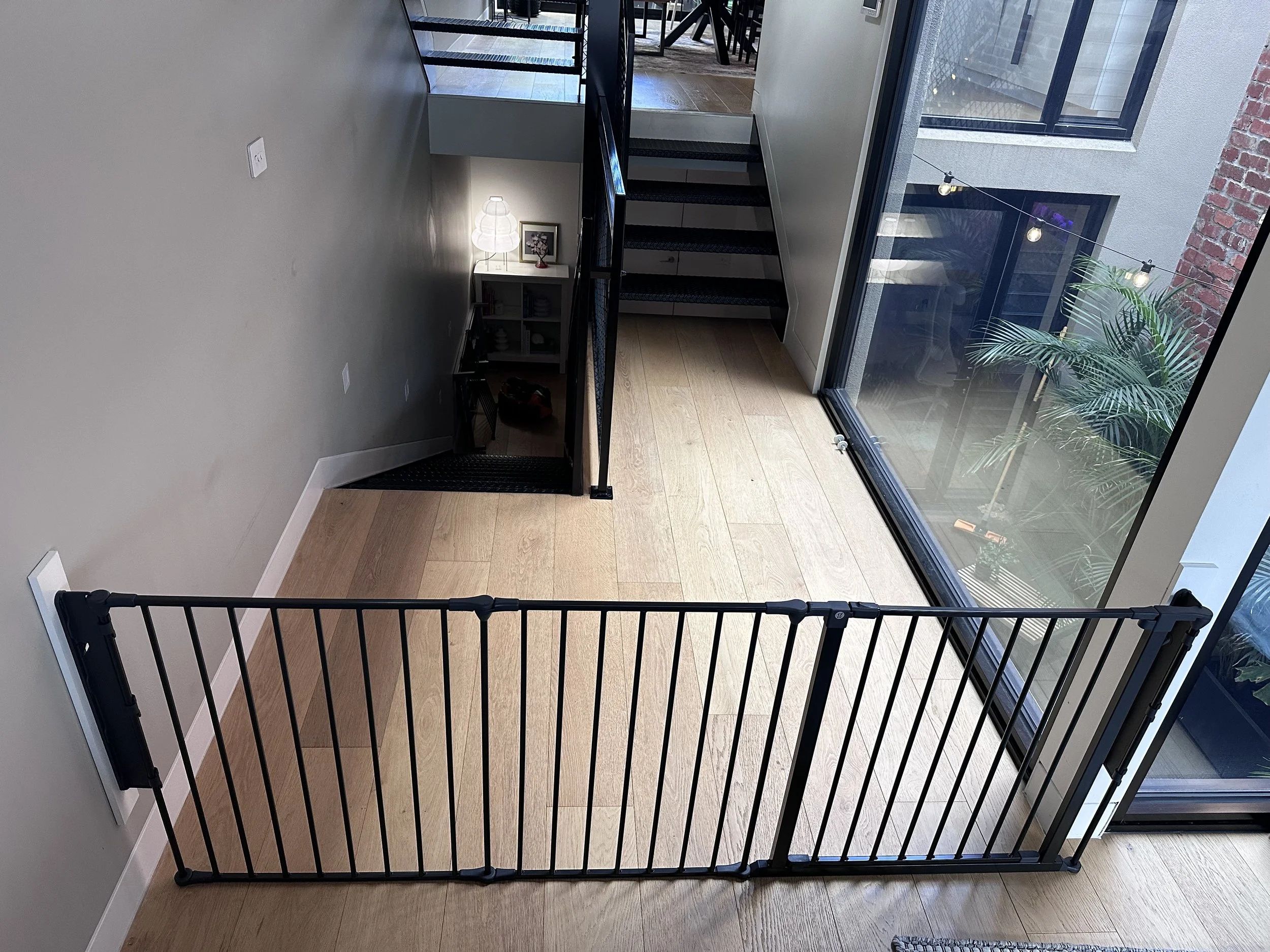 Black room divider across a wide opening