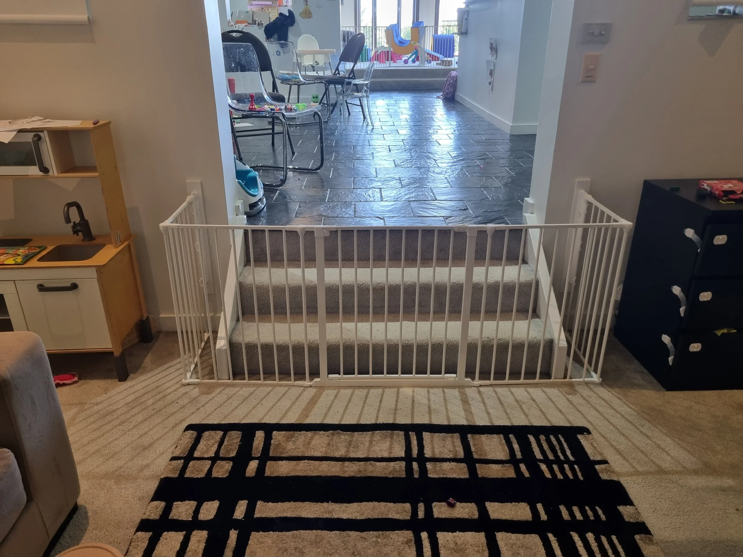White playpen in an open-plan living area