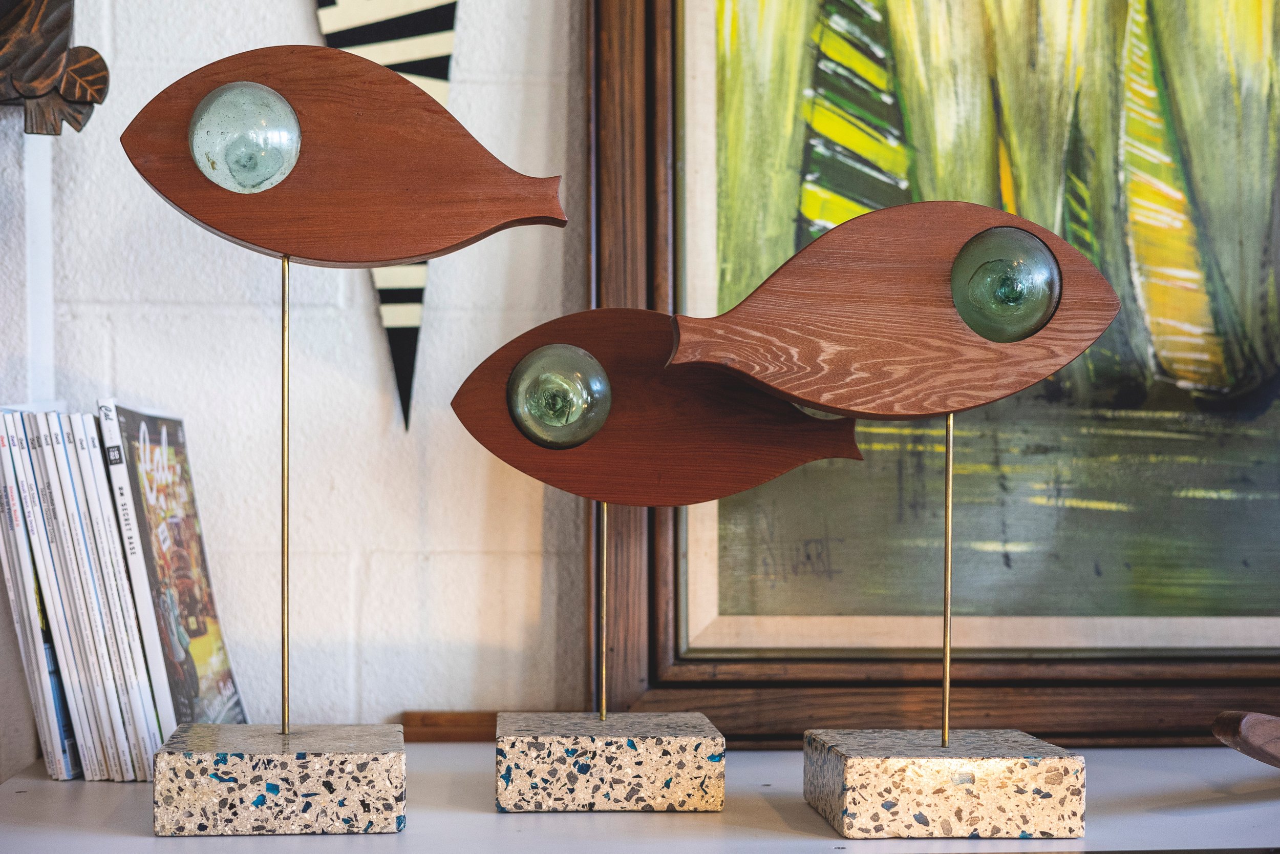  John Reyno carved these fish himself using salvaged redwood, found beach glass and concrete. After retiring to Hawai‘i, Reyno began restoring his own mid-century furniture. That enterprise led to establishing his own studio, Hawaii Modern.   Photos 