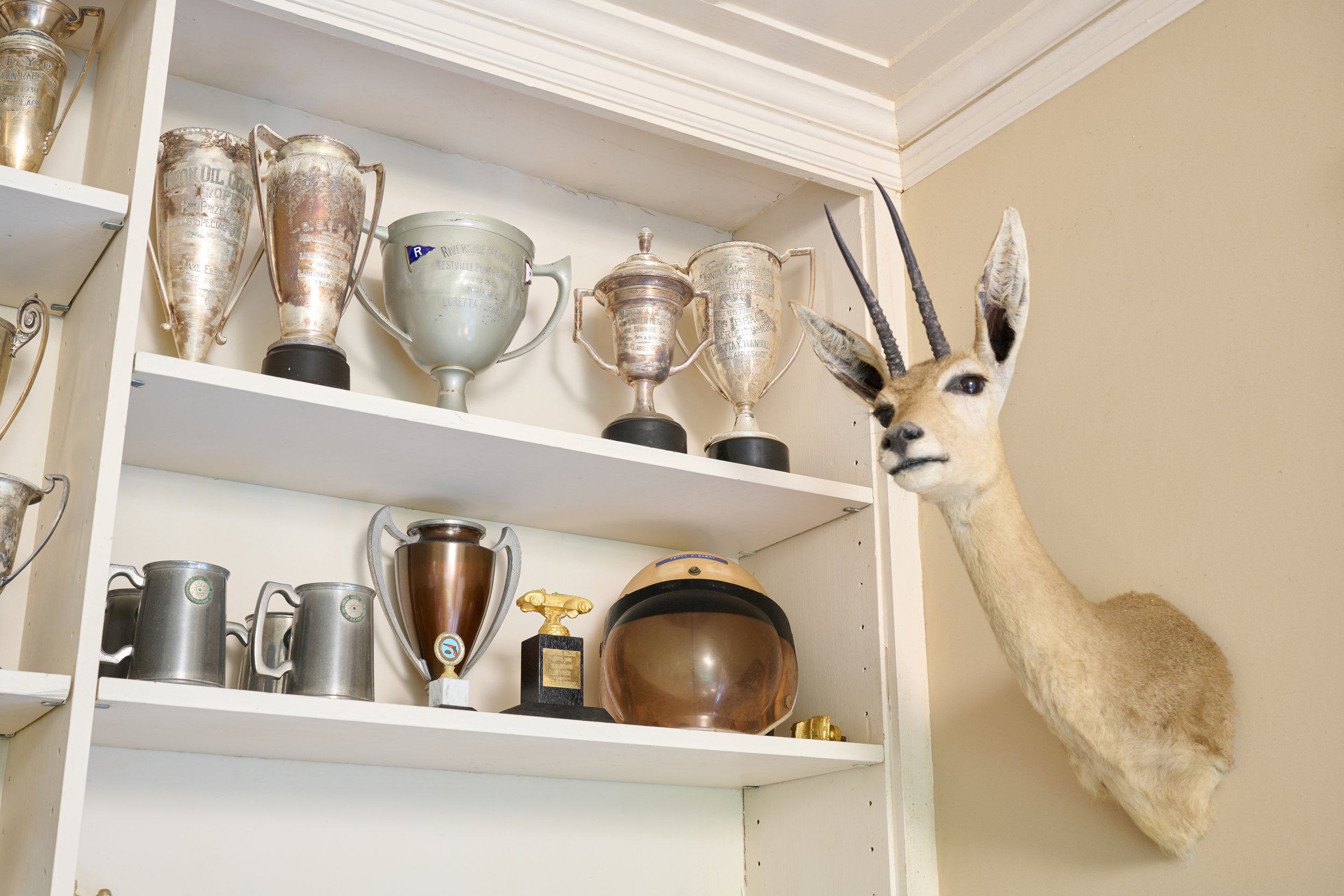  Trophies and sports memorabilia belonging to boat and car racer Loretta Turnbull Richert are proudly on display in daughter Tiare Richert Finney’s home in Nu‘uanu.    Photos by David Murphey  