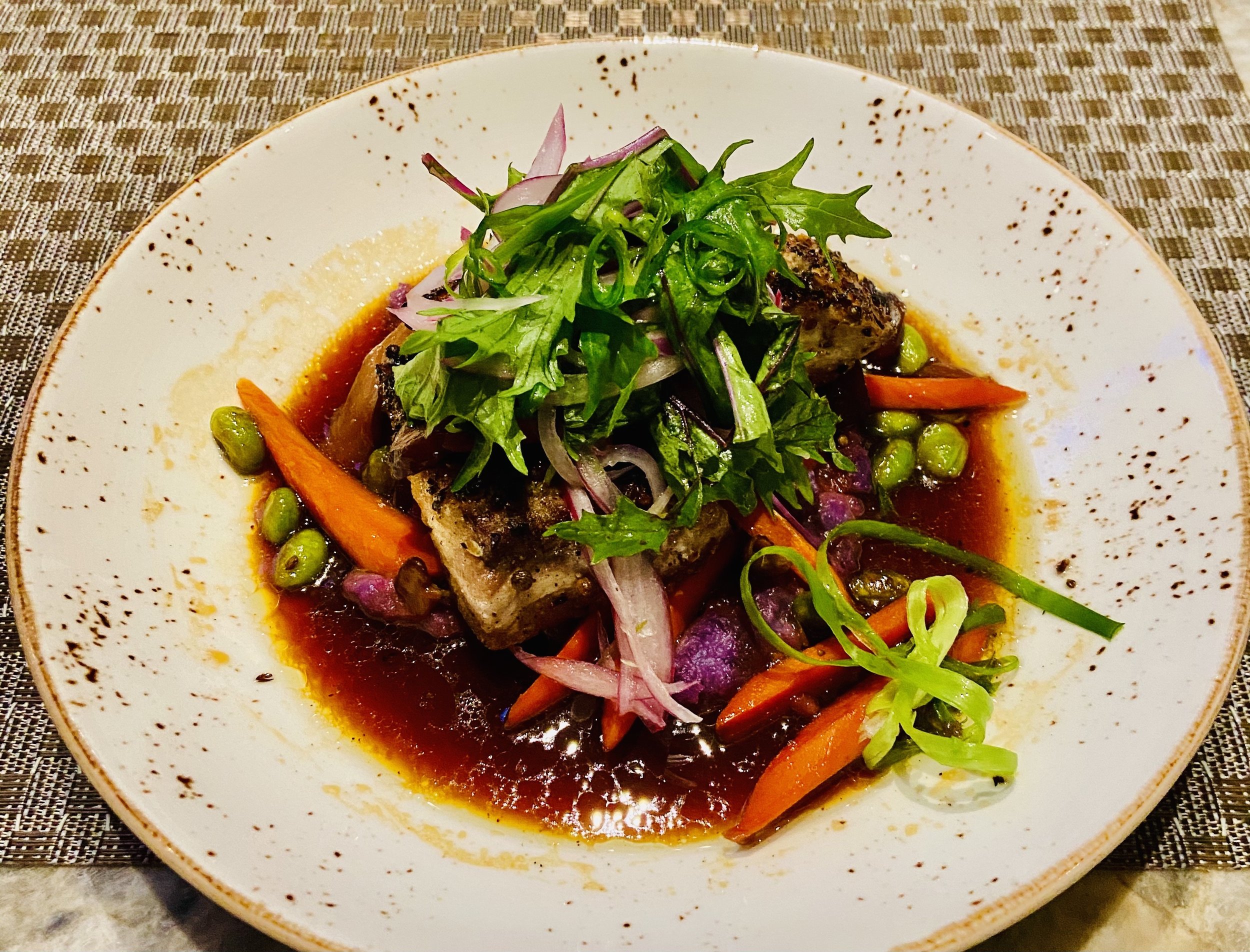  The Inamona Crusted Market Catch with Okinawan sweet potato, smoked carrots, and sweet and sour shiitake jus.  