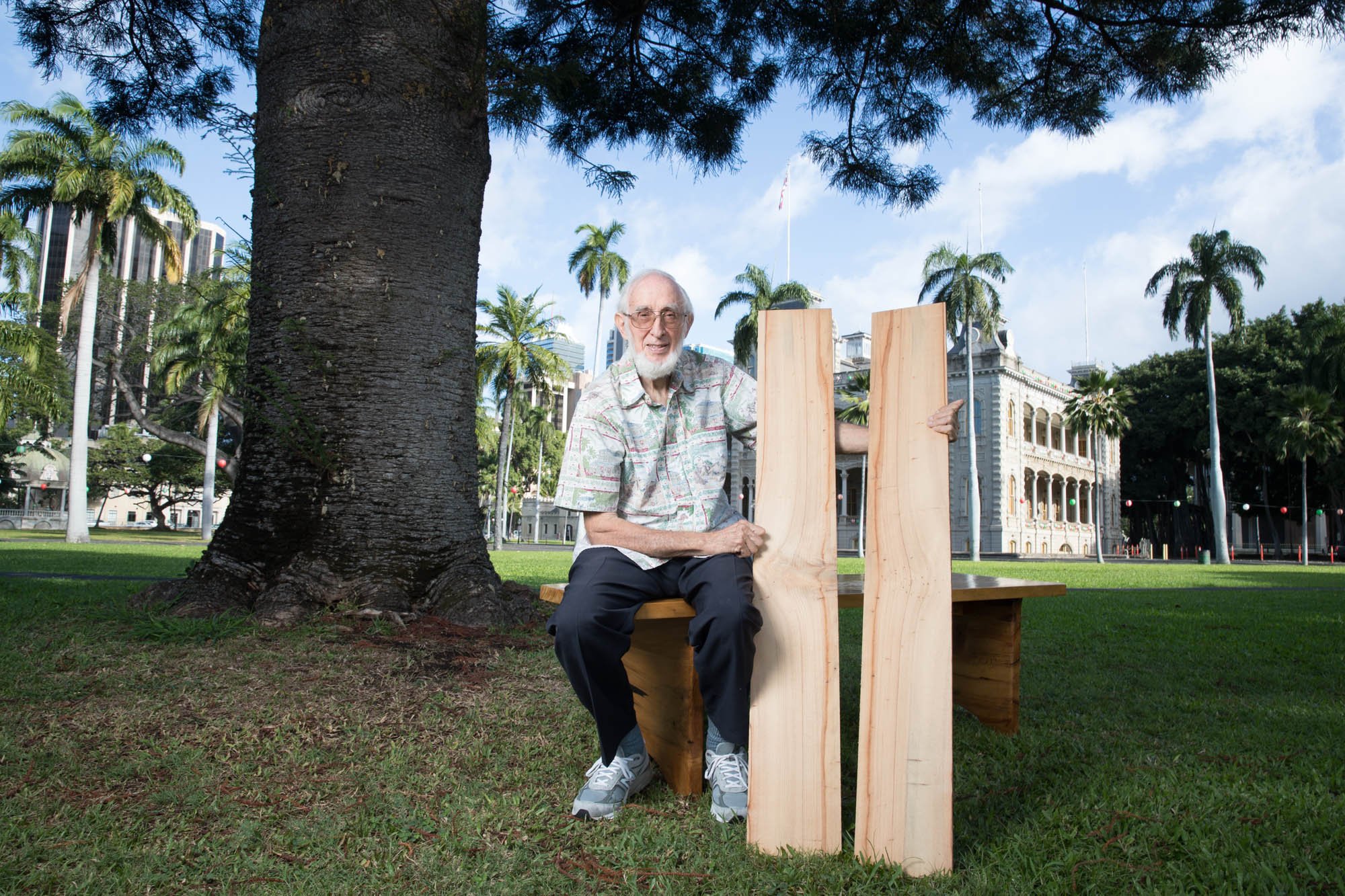  Dr. Brennan sits beneath a “sister pine” to the one that once grew on property that Queen Liliu‘okalani would visit. It was on one such visit that she witnessed a scene that would inspire her to write “Aloha ‘oe.”    Photo by Marco Garcia  