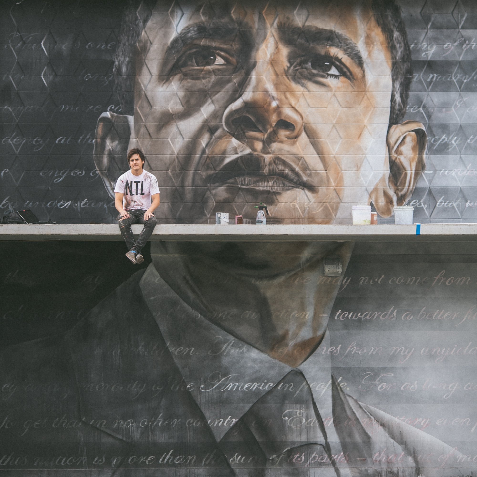 Kamea Hadar with his mural of Barack Obama titled  Hapa (photo by Andrew Tran) . 