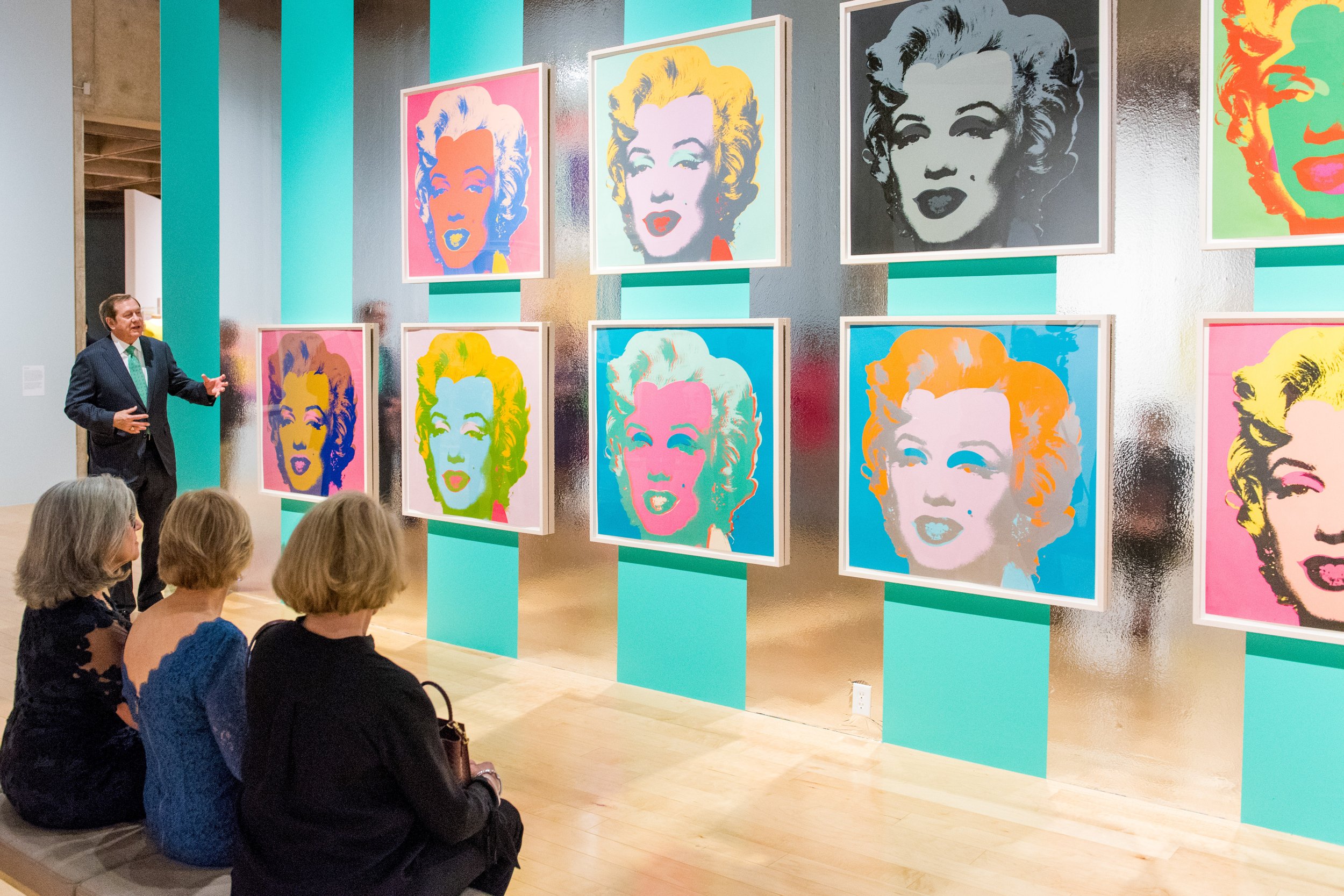  Schnitzer discussing Andy Warhol’s  Marilyn Monroe  series (1967) during  Andy Warhol: Prints from the Collections of Jordan D. Schnitzer and His Family Foundation  at the Palm Springs Art Museum.   Photo courtesy Jordan Schnitzer Family Foundation 