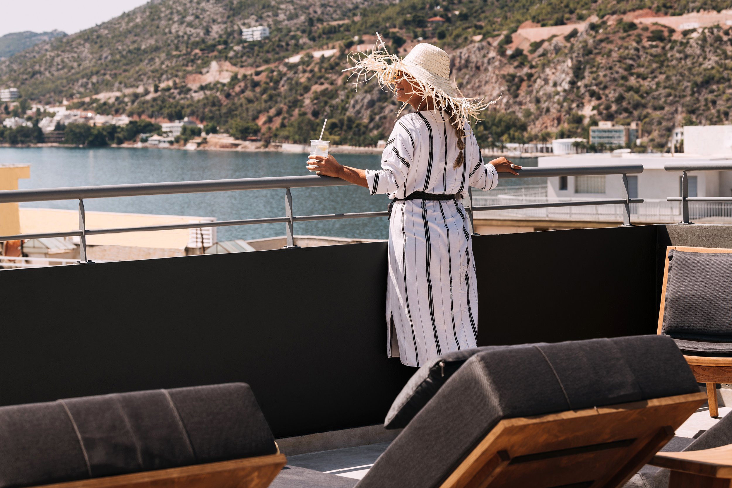 DAVE-by-the-beach-Loutraki-by-Brown-Hotels-Guest-gazing-at-sea-view-on-rooftop.jpg