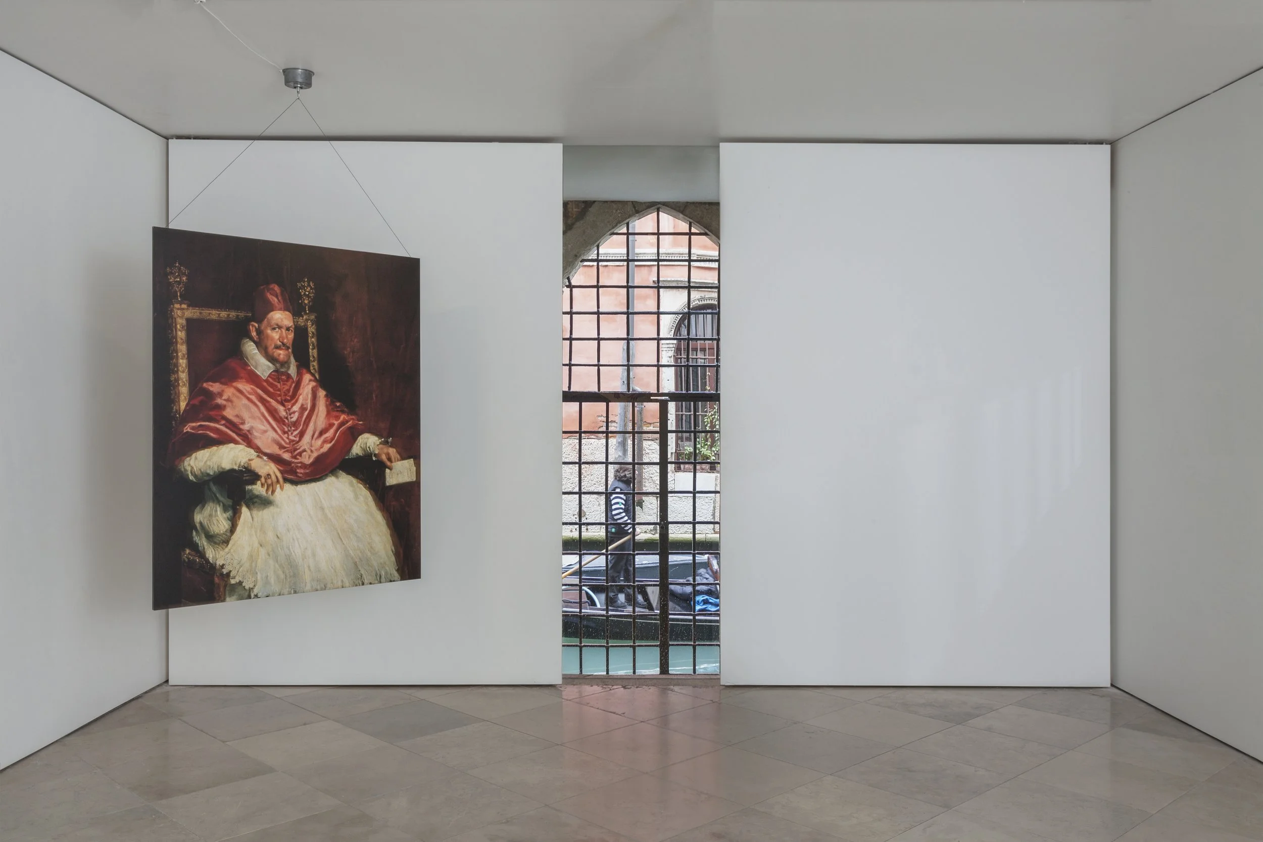 Mark Wallinger’s I Am Innocent (2010) is a life-size, double-sided reproduction of Velázquez’s Pope Innocent X, one side original, the other reversed. Suspended from the ceiling of an art gallery, it spins continuously, creating an optical effect.