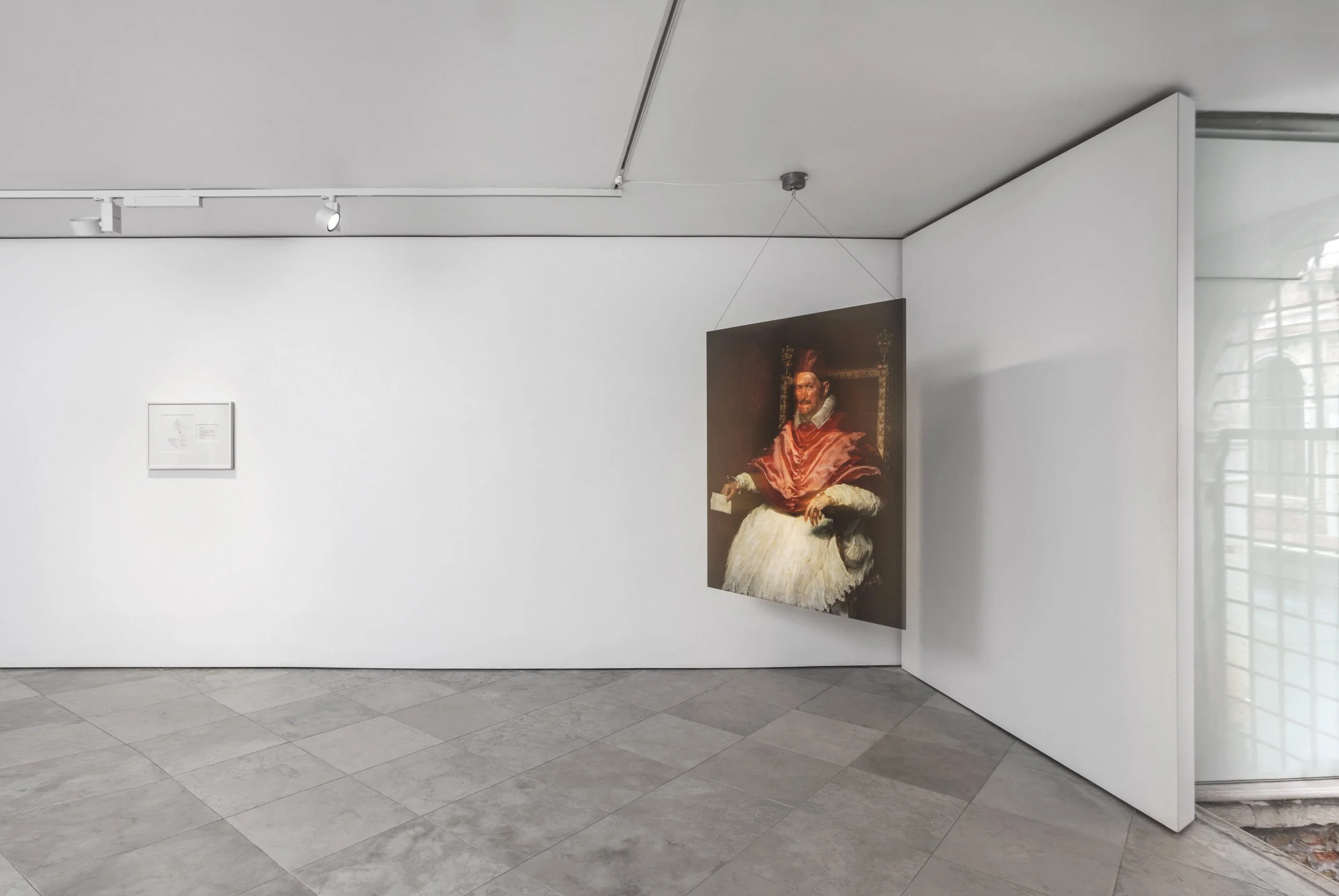 Mark Wallinger’s I Am Innocent (2010) is a life-size, double-sided reproduction of Velázquez’s Pope Innocent X, one side original, the other reversed. Suspended from the ceiling of an art gallery, it spins continuously, creating an optical effect.