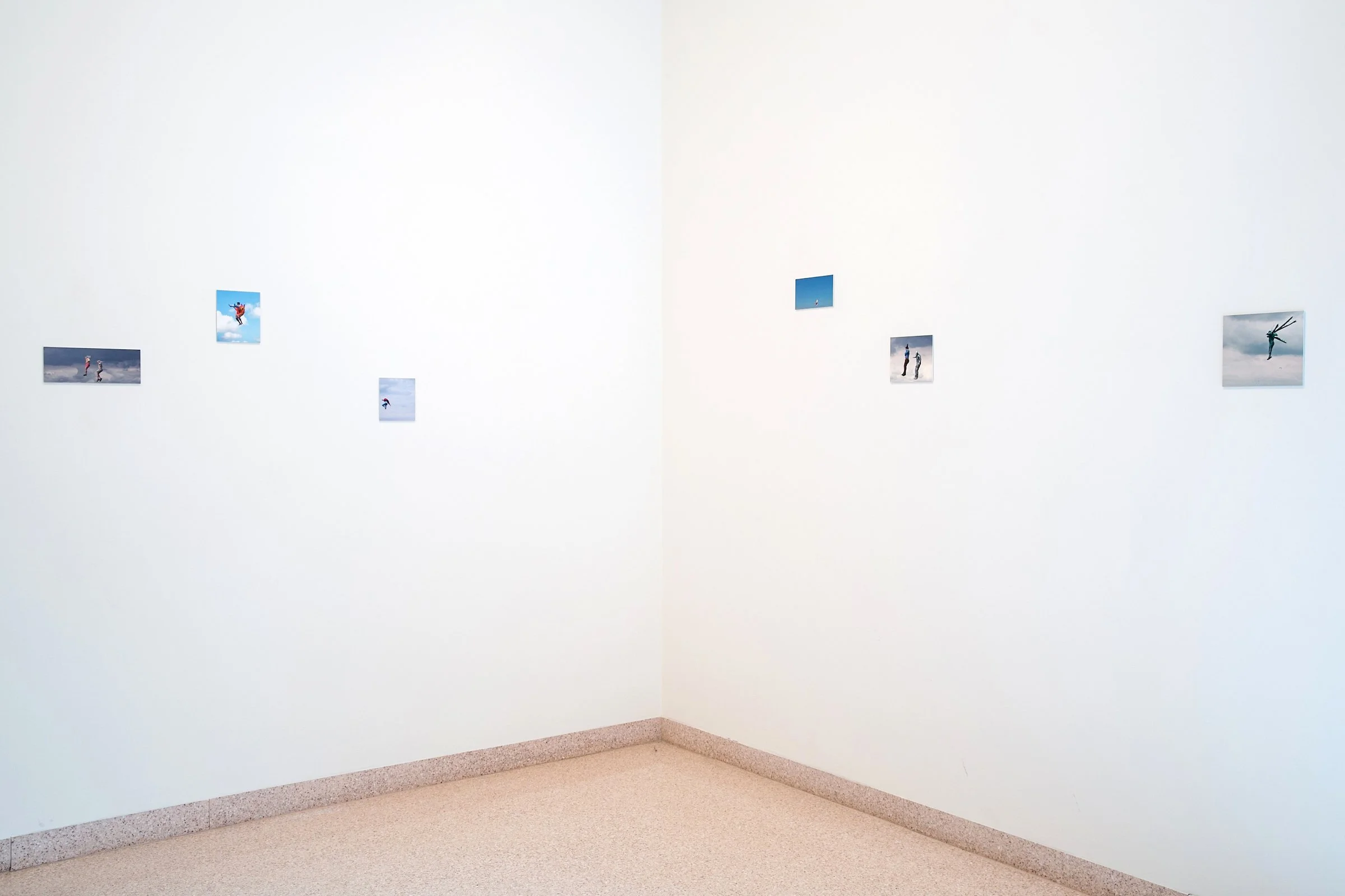 Gallery wall displaying Mark Wallinger's Birdman. The piece features cropped details taken from images of contestants at the International Birdman competition, which takes place on the Sussex coast.