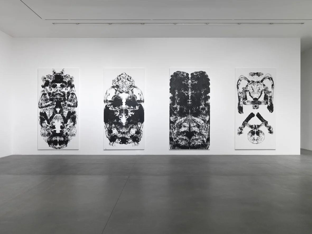 In a bright gallery, Mark Wallinger’s large id paintings (2015), scaled to his body, line the walls. The mirrored halves evoke the Vitruvian Man and Rorschach inkblots, created by sweeping paint-covered hands across the canvas.