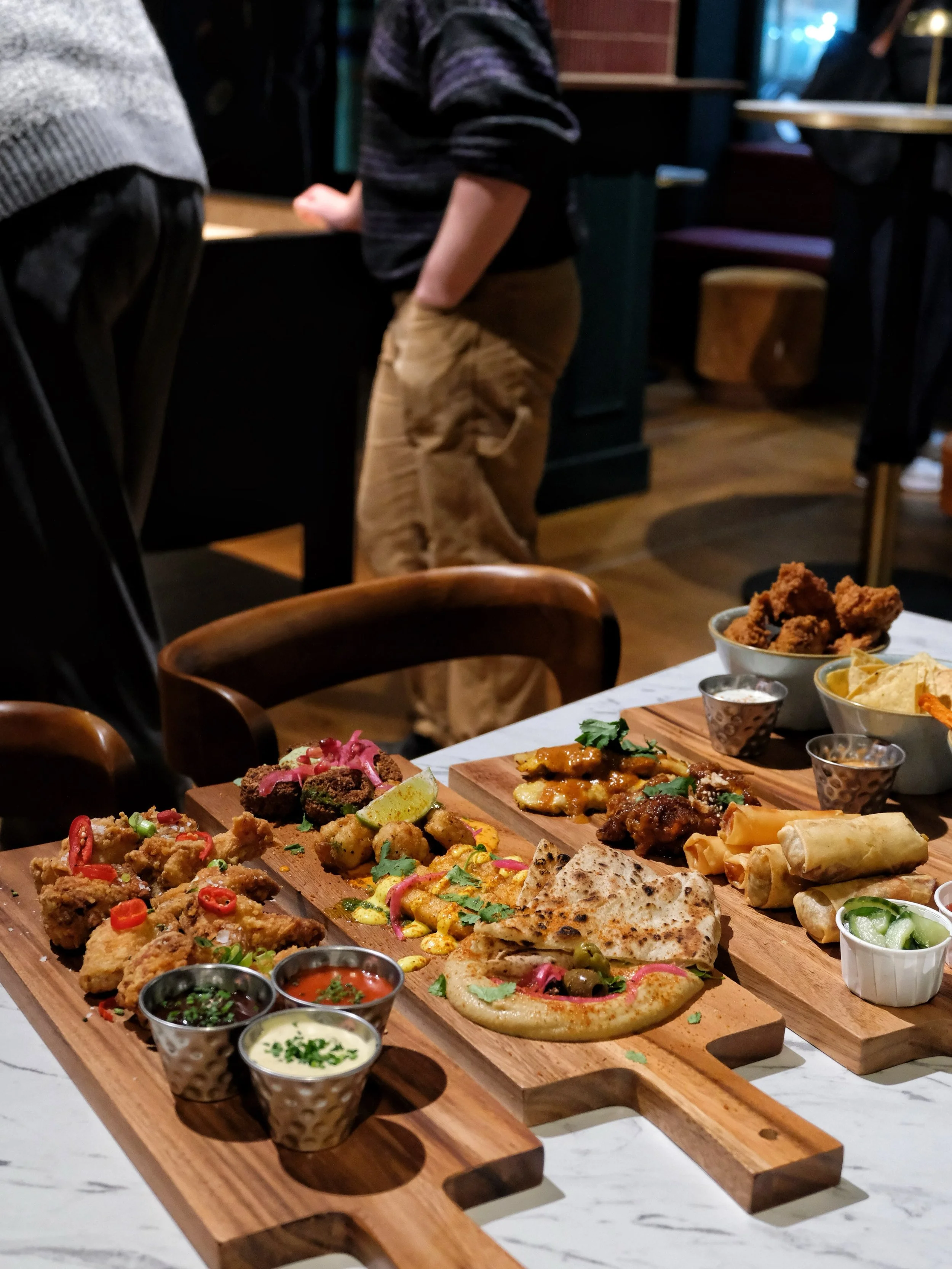 Sharing platters are now available at the Boardroom.

Order something to share between throws, straight from our kitchens.

Mosaic, Mezze medley: crispy spiced squid with harissa mayo and lime, falafel with coriander sauce and pickled red onion, hall
