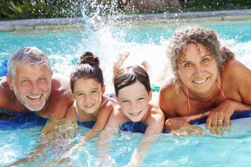 Bridge House Somerset - A family enjoying the heated swimming pool