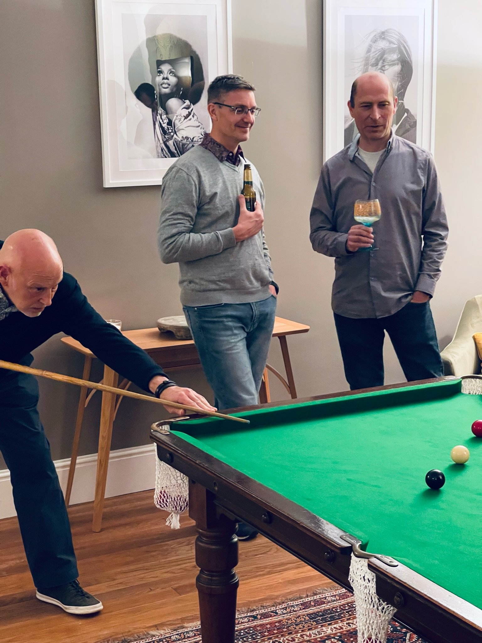 Bridge House multigenerational men relaxing playing snooker with drinks