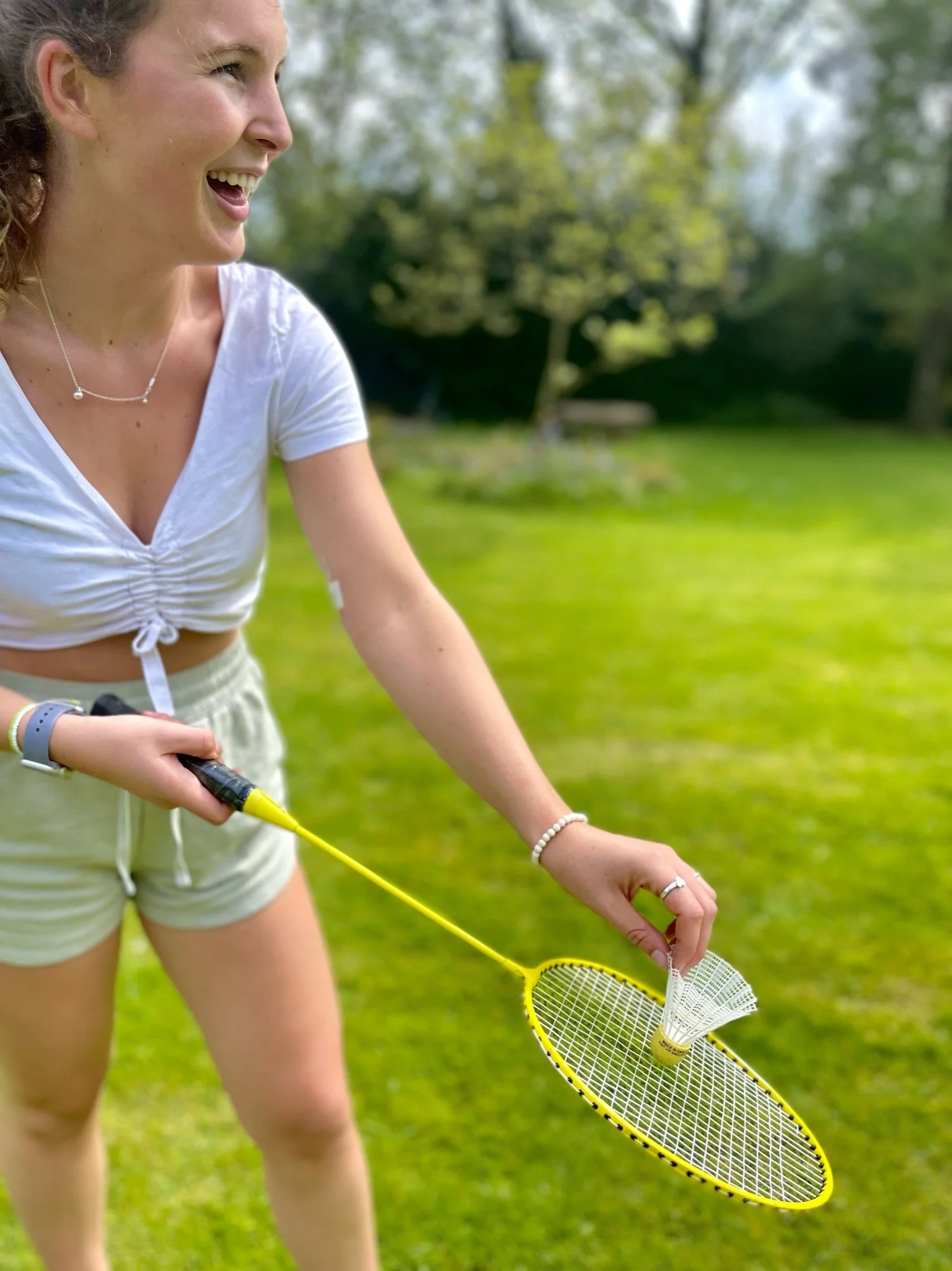 Bridge House lady playing badminton in large secluded private garden