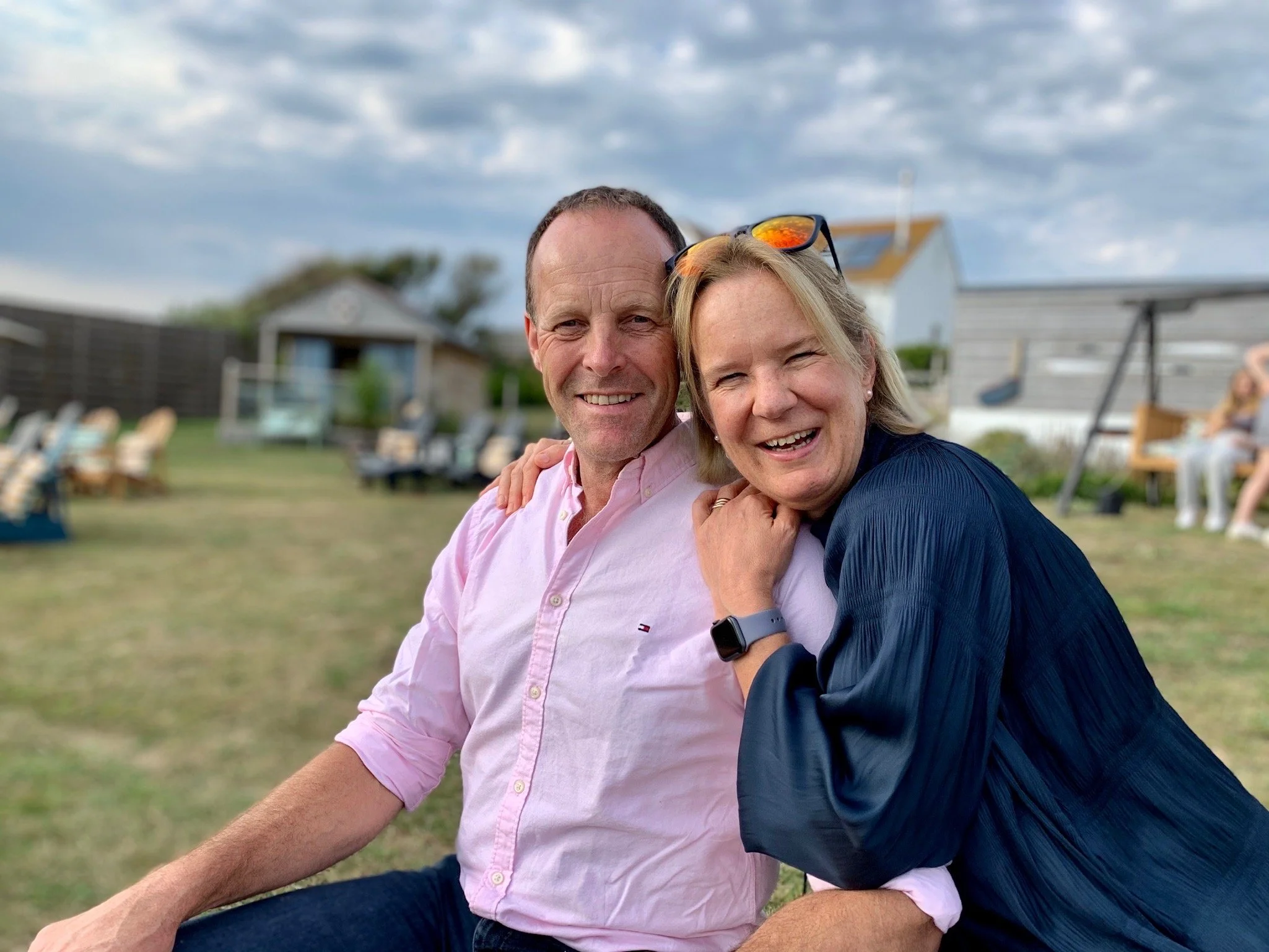Bridge House Somerset - Owners sitting together in garden.