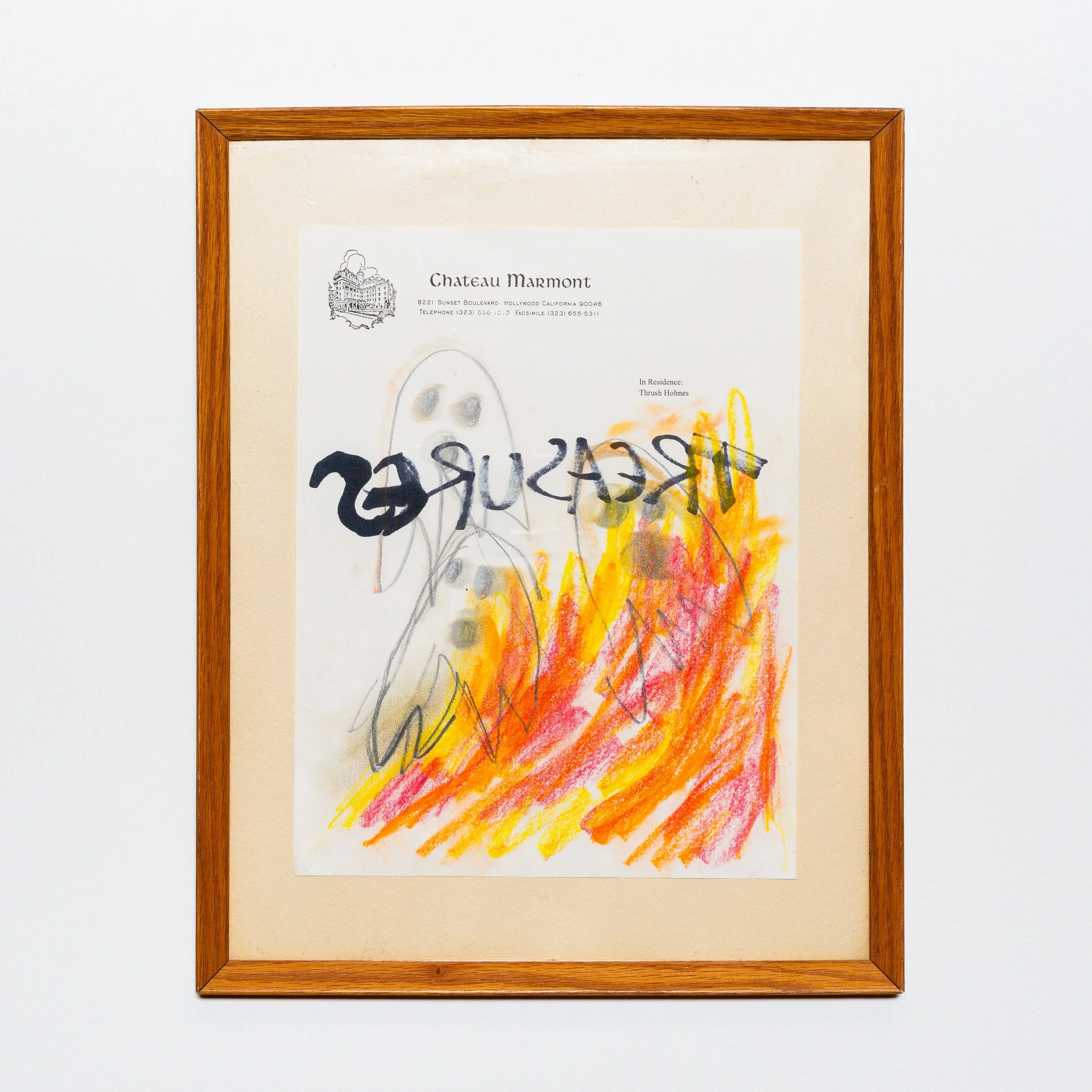 A framed piece of children's drawing with colorful scribbles and some black markings, mounted on a white wall.