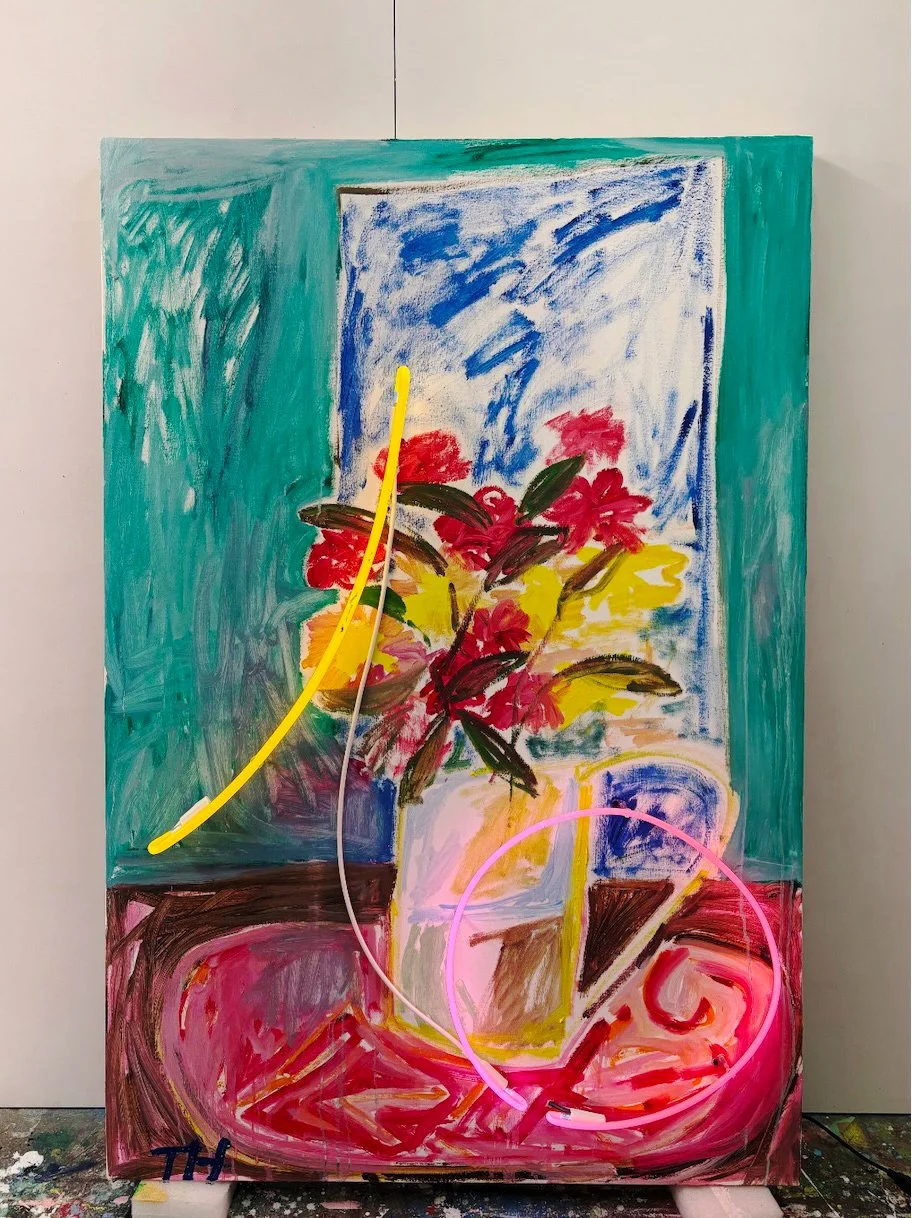 Colorful abstract painting of a flower vase with red flowers, green leaves, and a blue background, accented with neon pink and yellow light strips.