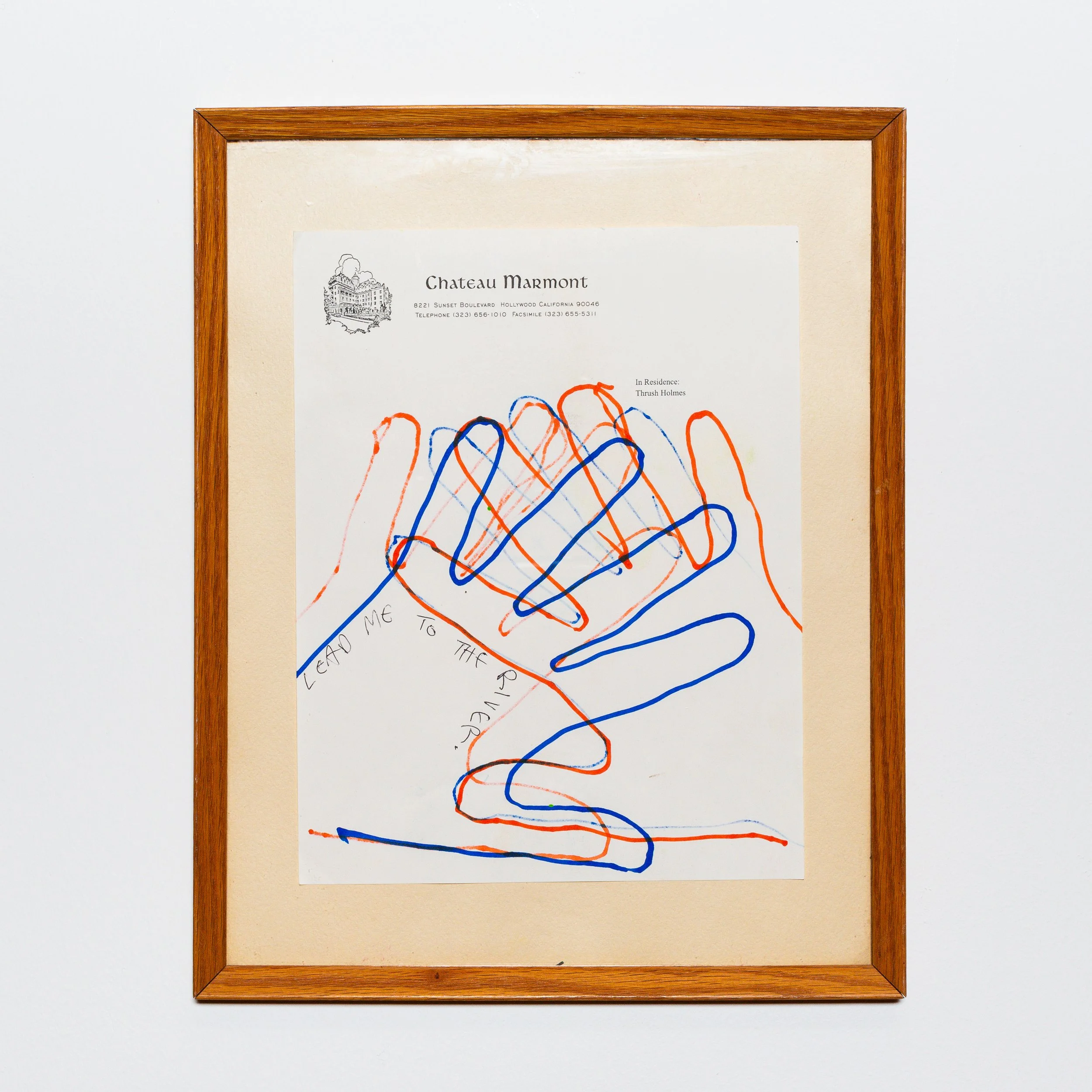A framed art piece featuring colorful, intertwined squiggly lines in orange, blue, and green, on a white background, labeled with artist and location details at the top.