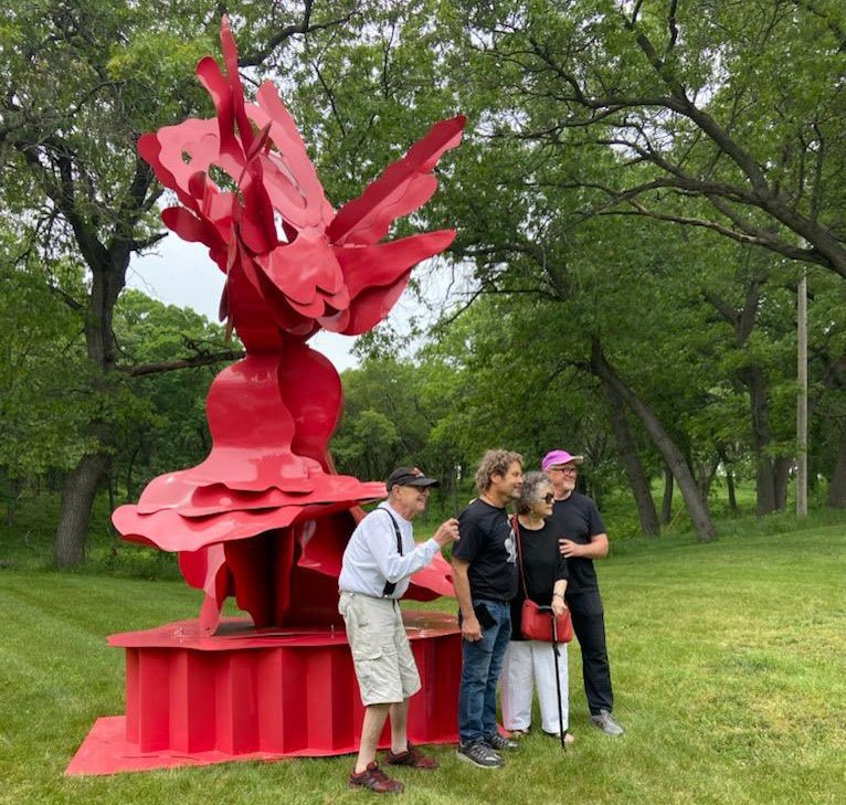  From left: CSI members Mike Grucza,  Bruce Niemi , Ruth Migdal, and  Terry Karpowicz  stand in front of Ruth Migdal's sculpture  Here . (Photo credit: Karin Crane) 