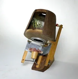 Dialogue" by John T. Upchurch and Rebekka Federle, 4 1/2” x 7” x 5”, Antique print material, wood, sheet metal, string, steel wire, found objects