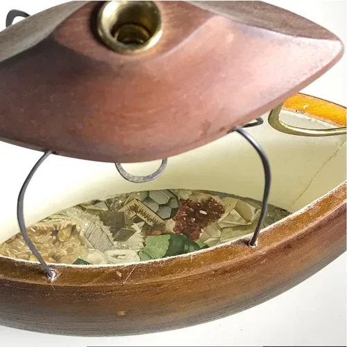 "Loupe" (side view) by John T. Upchurch and Rebekka Federle, 10" x 10" x 4", Antique print material, wood, steel and brass wire, paper, found objects