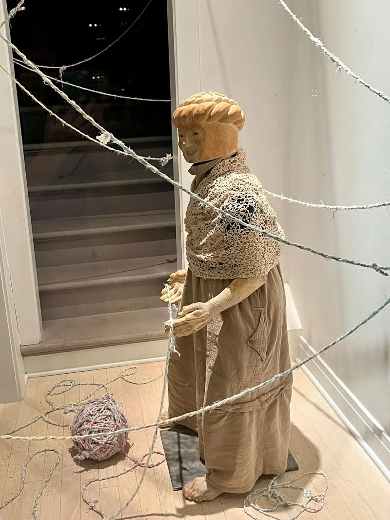 Alison Ford, "Spider and Baba Paska", Ceramic and found object sculpture, cast bronze ("Spider"). Old fabric scraps transcribed with family history spun and plied into 1000 feet of material (spider web)
